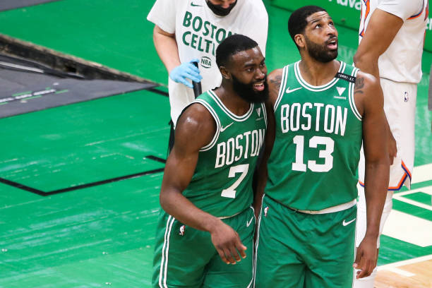 BOSTON, MA - APRIL 7: Jaylen Brown #7 and Tristan Thompson #13 of the Boston Celtics hug in the first half against the New York Knicks at TD Garden on April 7, 2021 in Boston, Massachusetts. NOTE TO USER: User expressly acknowledges and agrees that, by downloading and or using this photograph, User is consenting to the terms and conditions of the Getty Images License Agreement. (Photo by Kathryn Riley/Getty Images)