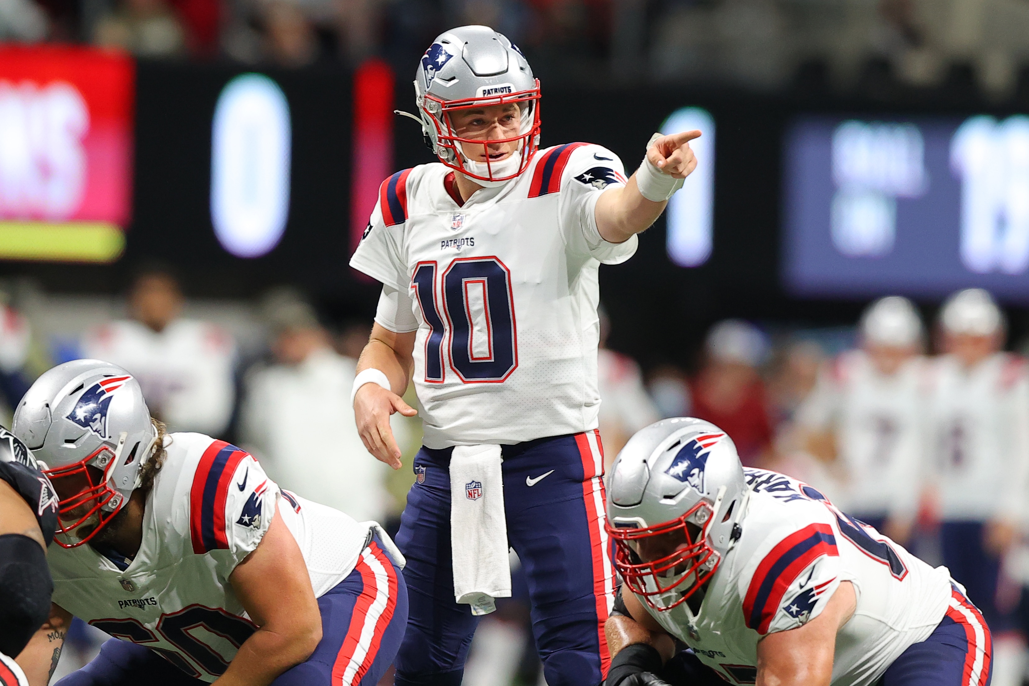 ATLANTA, GEORGIA - NOVEMBER 18: Mac Jones #10 of the New England Patriots reacts during the game against the Atlanta Falcons in the first quarter at Mercedes-Benz Stadium on November 18, 2021 in Atlanta, Georgia. (Photo by Todd Kirkland/Getty Images)