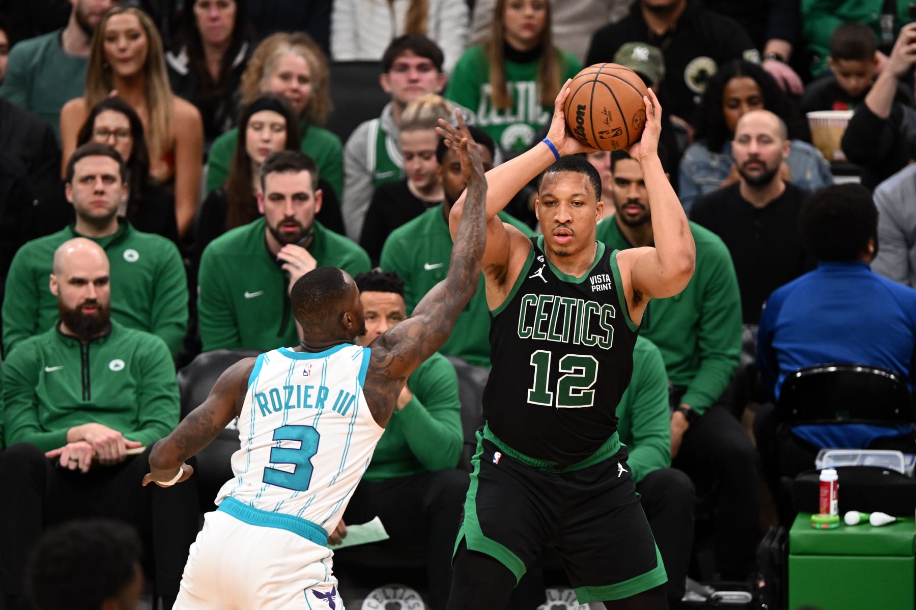 BOSTON, MASSACHUSETTS - FEBRUARY 10: Grant Williams #12 of the Boston Celtics looks to pass the ball around Terry Rozier #3 of the Charlotte Hornets during the second quarter of the game at the TD Garden on February 10, 2023 in Boston, Massachusetts. NOTE TO USER: User expressly acknowledges and agrees that, by downloading and or using this photograph, User is consenting to the terms and conditions of the Getty Images License Agreement. (Photo by Brian Fluharty/Getty Images)