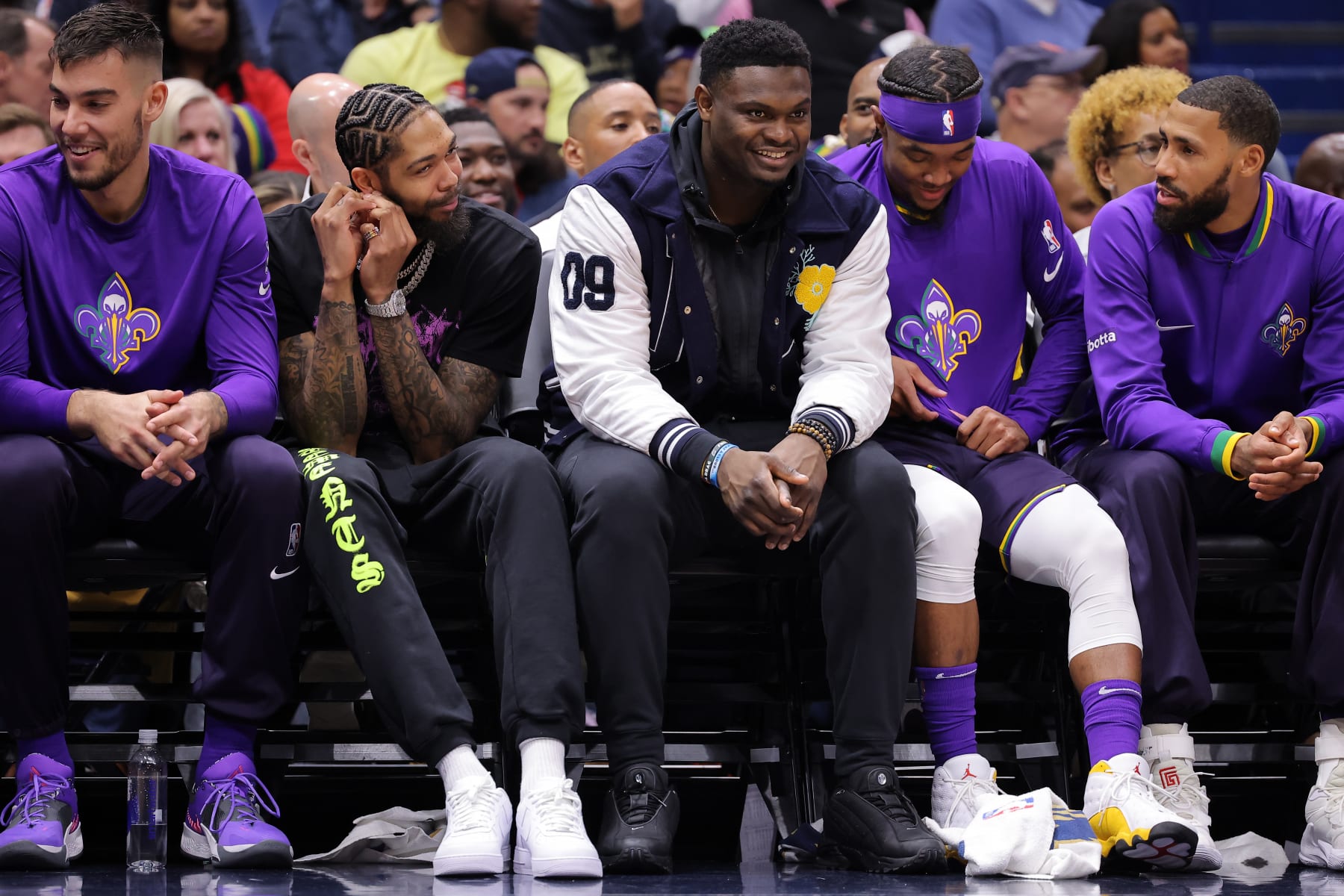 NEW ORLEANS, LOUISIANA - JANUARY 06: Zion Williamson #1 (C) and Brandon Ingram #14 (2nd L) of the New Orleans Pelicans react during the first half against the Brooklyn Nets at the Smoothie King Center on January 06, 2023 in New Orleans, Louisiana. NOTE TO USER: User expressly acknowledges and agrees that, by downloading and or using this Photograph, user is consenting to the terms and conditions of the Getty Images License Agreement. (Photo by Jonathan Bachman/Getty Images)