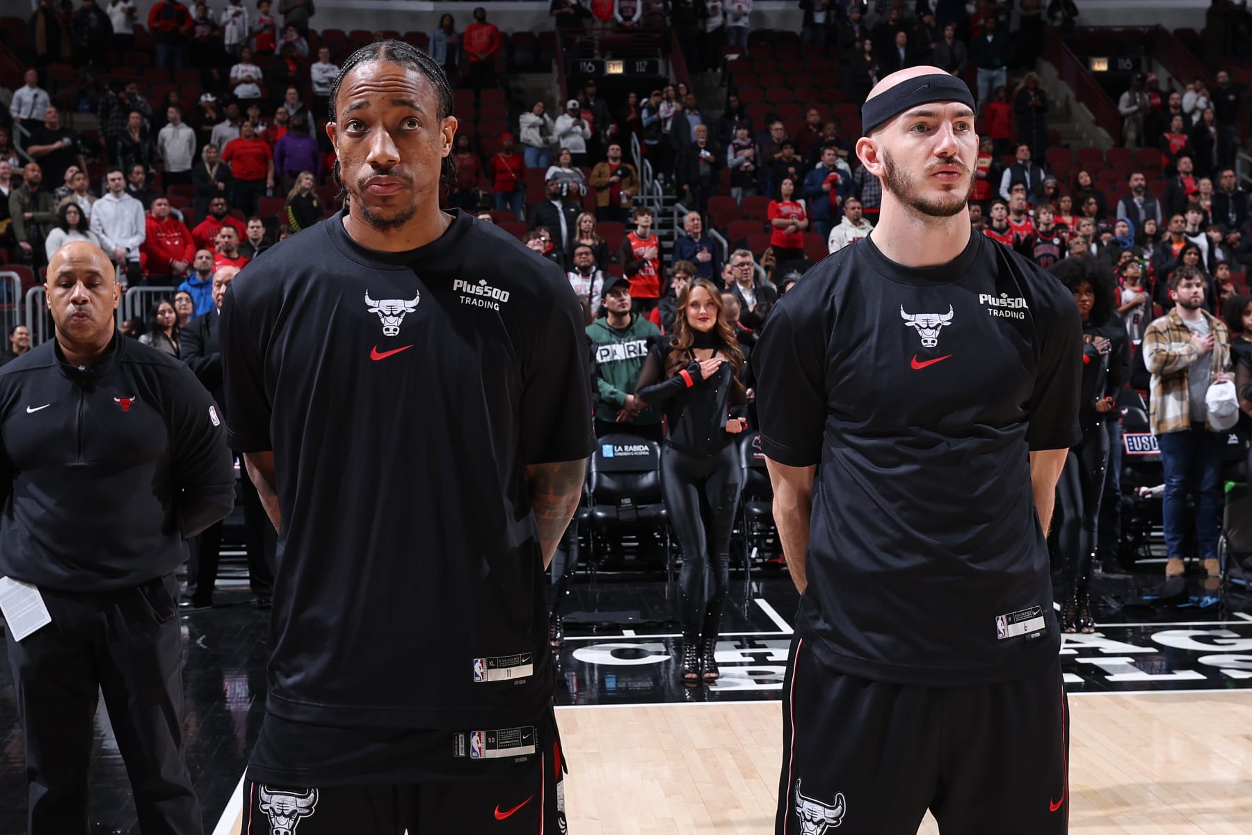 CHICAGO, IL - JANUARY 30: DeMar DeRozan #11 and Alex Caruso #6 of the Chicago Bulls stand for the National Anthem before the game against the Toronto Raptors on January 30, 2024 at United Center in Chicago, Illinois. NOTE TO USER: User expressly acknowledges and agrees that, by downloading and or using this photograph, User is consenting to the terms and conditions of the Getty Images License Agreement. Mandatory Copyright Notice: Copyright 2024 NBAE (Photo by Jeff Haynes/NBAE via Getty Images)