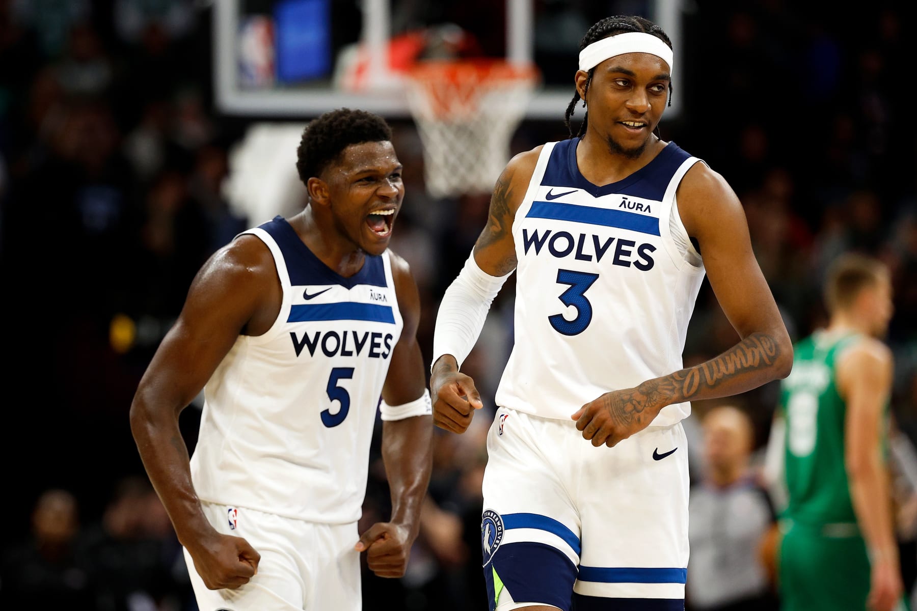 MINNEAPOLIS, MINNESOTA - NOVEMBER 06: Jaden McDaniels #3 of the Minnesota Timberwolves celebrates his basket against the Boston Celtics with Anthony Edwards #5 in overtime at Target Center on November 06, 2023 in Minneapolis, Minnesota. The Timberwolves defeated the Celtics 114-109 in overtime. NOTE TO USER: User expressly acknowledges and agrees that, by downloading and or using this photograph, User is consenting to the terms and conditions of the Getty Images License Agreement. (Photo by David Berding/Getty Images)