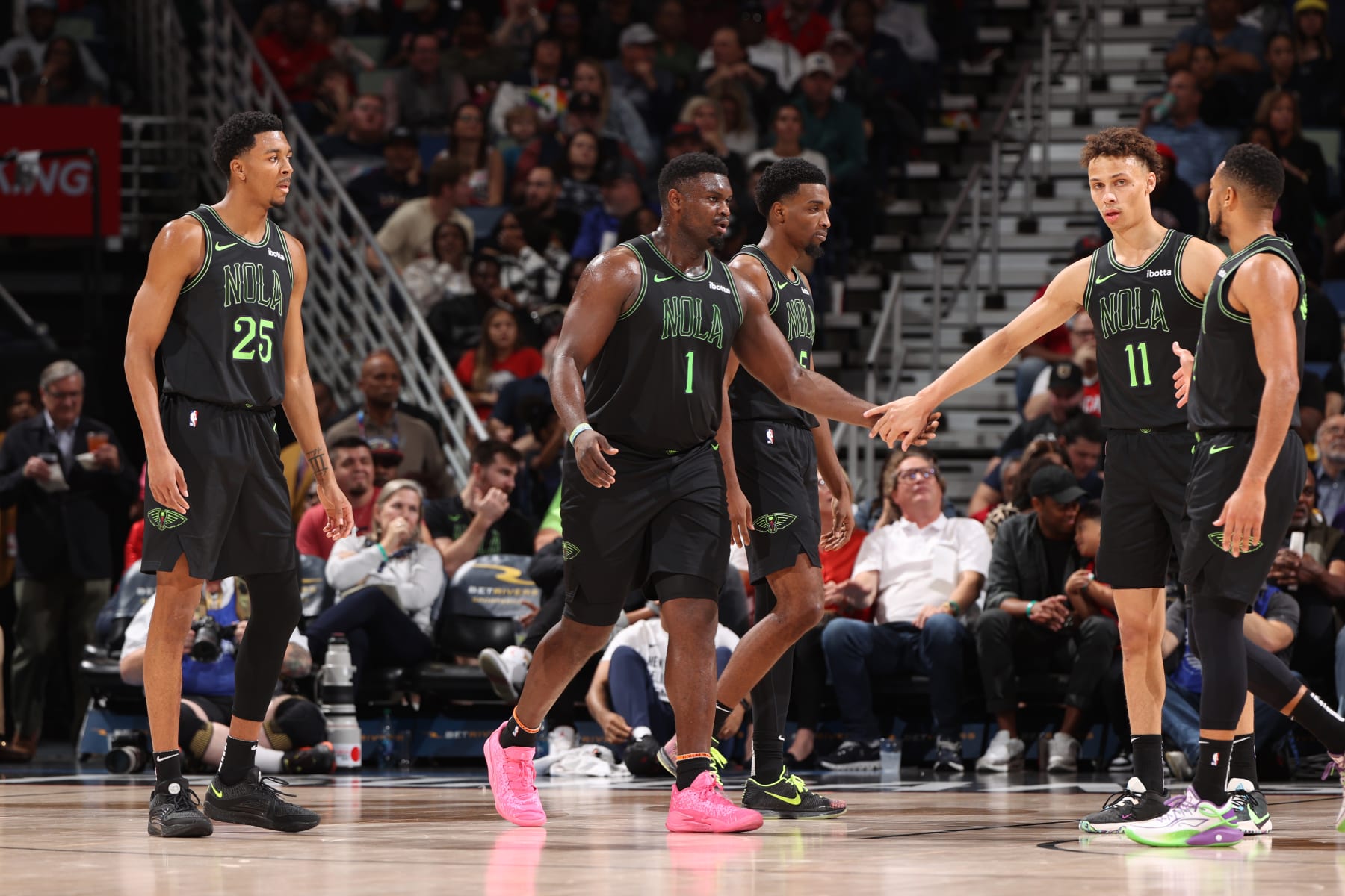 NEW ORLEANS, LA - DECEMBER 1: Trey Murphy III #25, Zion Williamson #1, Herb Jones #5, Dyson Daniels #11 and CJ McCollum #3 of the New Orleans Pelicans stand on the court during the game against the San Antonio Spurs on December 1, 2023 at the Smoothie King Center in New Orleans, Louisiana. NOTE TO USER: User expressly acknowledges and agrees that, by downloading and or using this Photograph, user is consenting to the terms and conditions of the Getty Images License Agreement. Mandatory Copyright Notice: Copyright 2023 NBAE (Photo by Joe Murphy/NBAE via Getty Images)