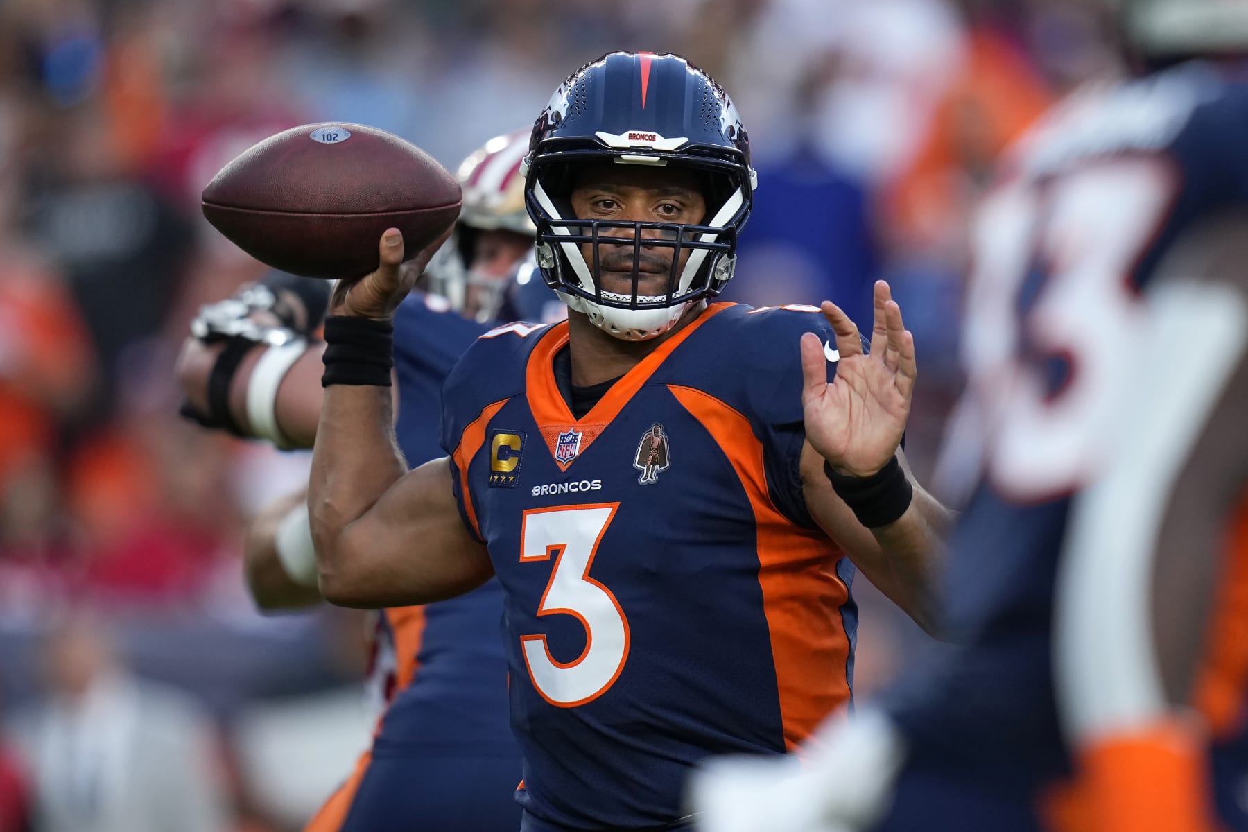 Denver Broncos quarterback Russell Wilson (3) passes against the San Francisco 49ers during the first half of an NFL football game in Denver, Sunday, Sept. 25, 2022. (AP Photo/Jack Dempsey)
