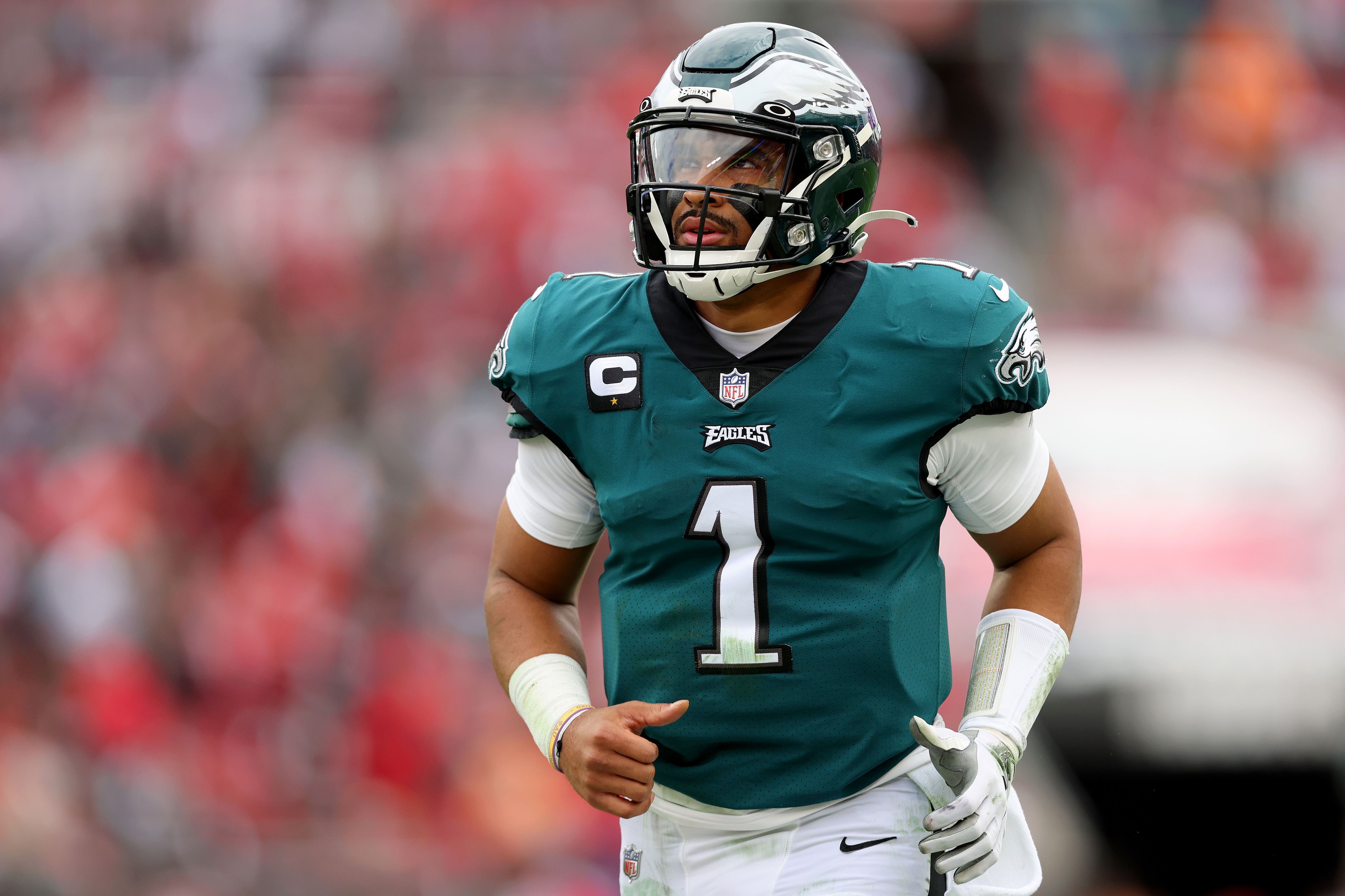 TAMPA, FLORIDA - JANUARY 16: Jalen Hurts #1 of the Philadelphia Eagles runs off the field at the end of the second quarter in the NFC Wild Card Playoff game against the Tampa Bay Buccaneers at Raymond James Stadium on January 16, 2022 in Tampa, Florida. (Photo by Michael Reaves/Getty Images)