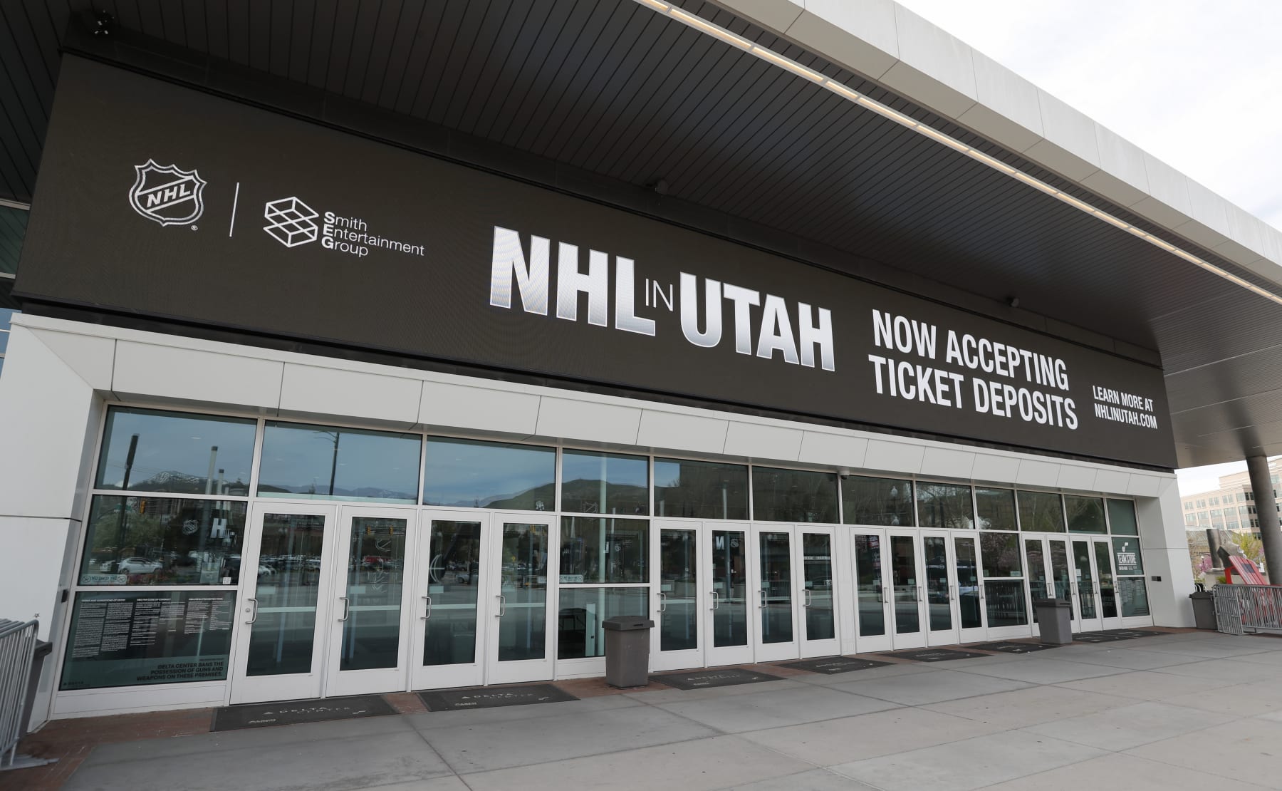 SALT LAKE CITY, UT - APRIL 19: The main entrance of the Delta Center is seen with the "NHL in Utah" logos on April 19, 2024 in Salt Lake City, Utah. The NHL has allowed the sale of the Arizona Coyotes and the team will relocate to Salt Lake City, Utah. (Photo by Chris Gardner/Getty Images)