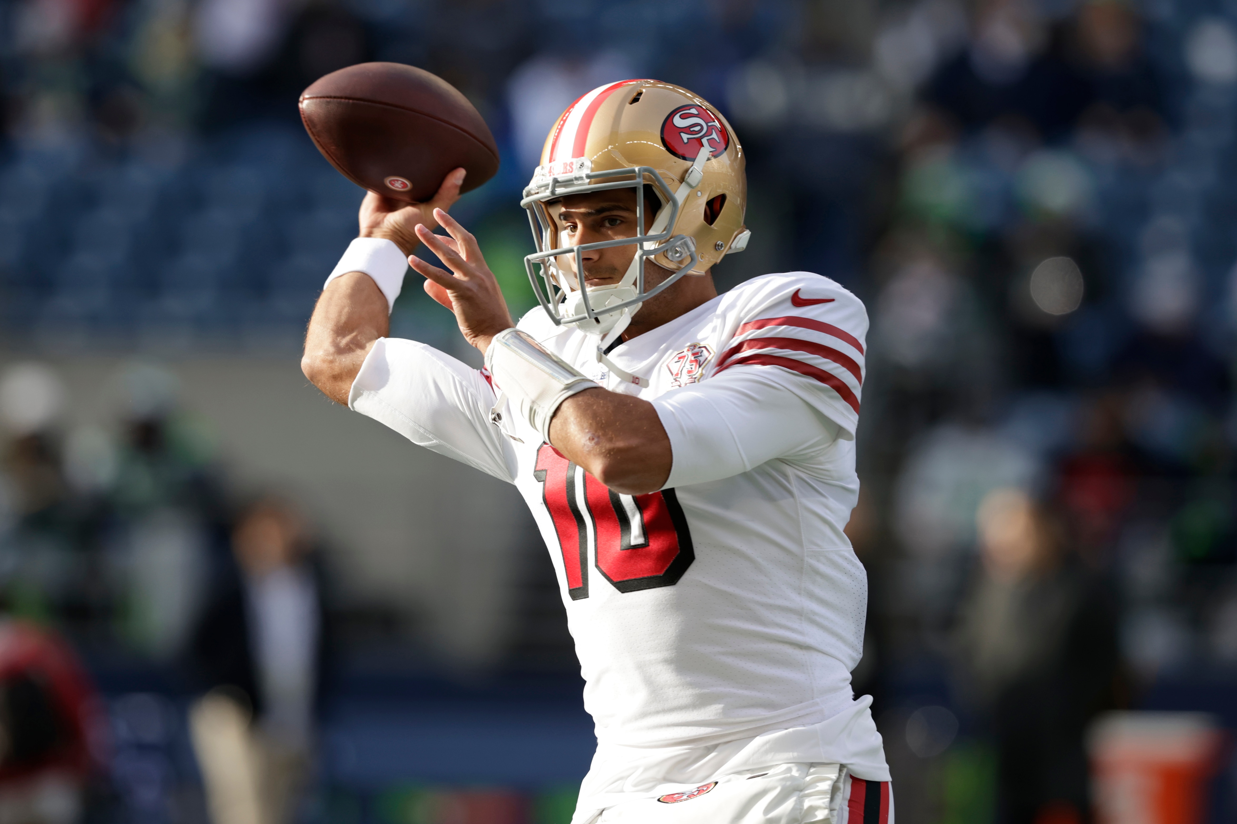 San Francisco 49ers quarterback Jimmy Garoppolo passes during warmups before an NFL football game against the Seattle Seahawks, Sunday, Dec. 5, 2021, in Seattle. (AP Photo/John Froschauer)