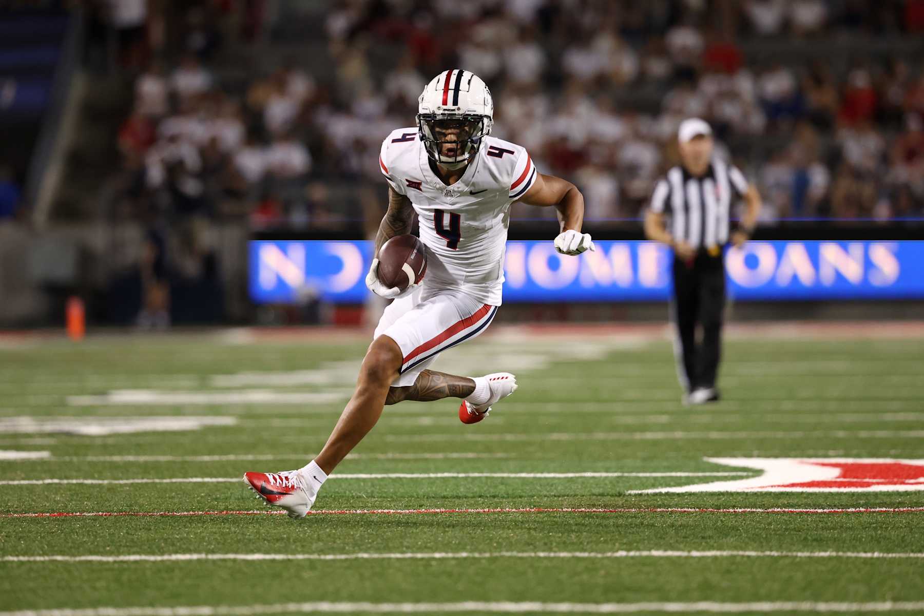 TUCSON, ARIZONA - AUGUST 31: Wide receiver Tetairoa McMillan #4 of the Arizona Wildcats runs during the second half against the New Mexico Lobos at Arizona Stadium on August 31, 2024 in Tucson, Arizona. McMillan has set the program single game receiving record.  (Photo by Chris Coduto/Getty Images)