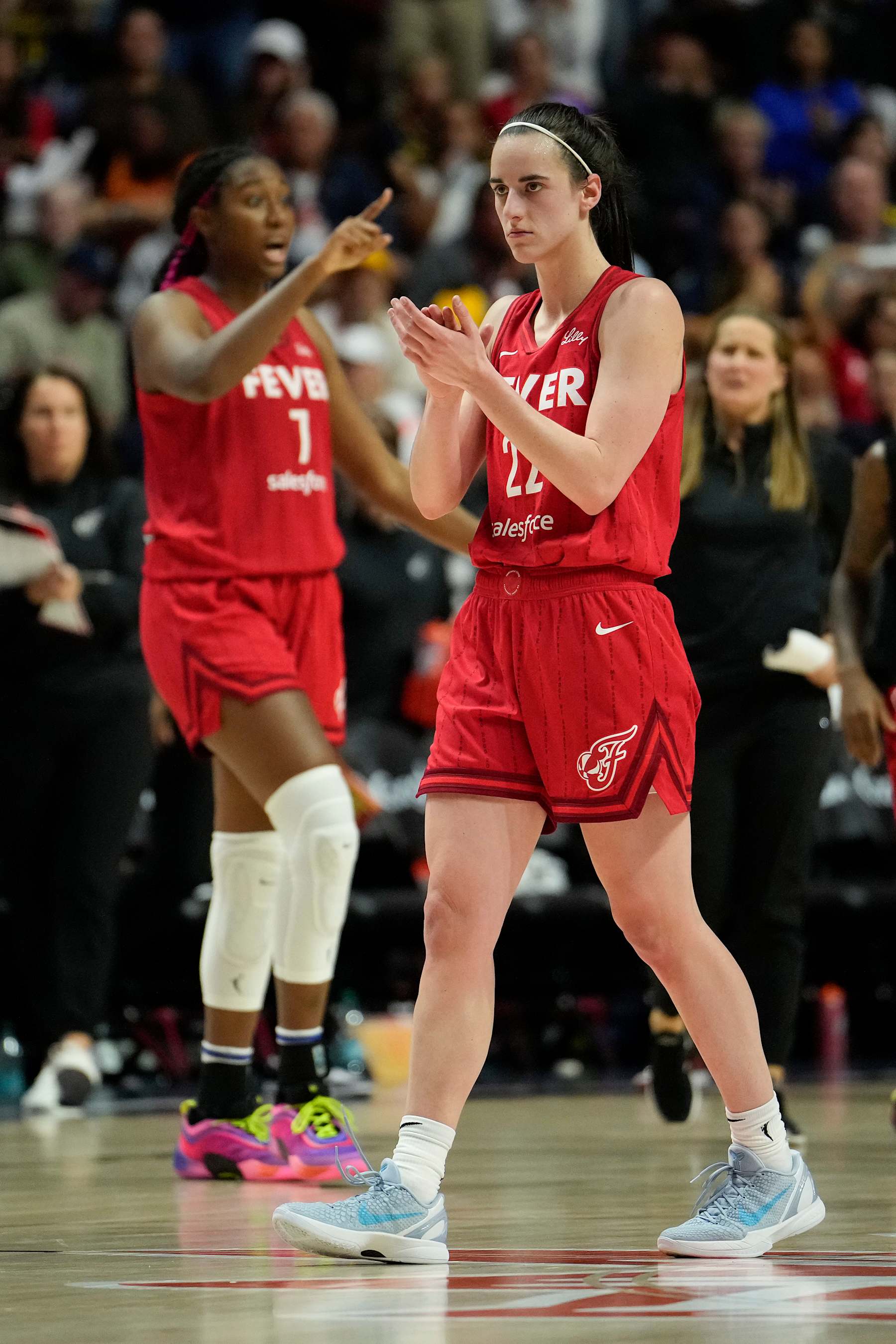 UNCASVILLE, CONNECTICUT - SEPTEMBER 25:  Aliyah Boston #7 and Caitlin Clark #22 of the Indiana Fever reacts as they play the Connecticut Sun during the fourth quarter of Game Two of the 2024 WNBA Playoffs first round at Mohegan Sun Arena on September 25, 2024 in Uncasville, Connecticut. (Photo by Joe Buglewicz/Getty Images)