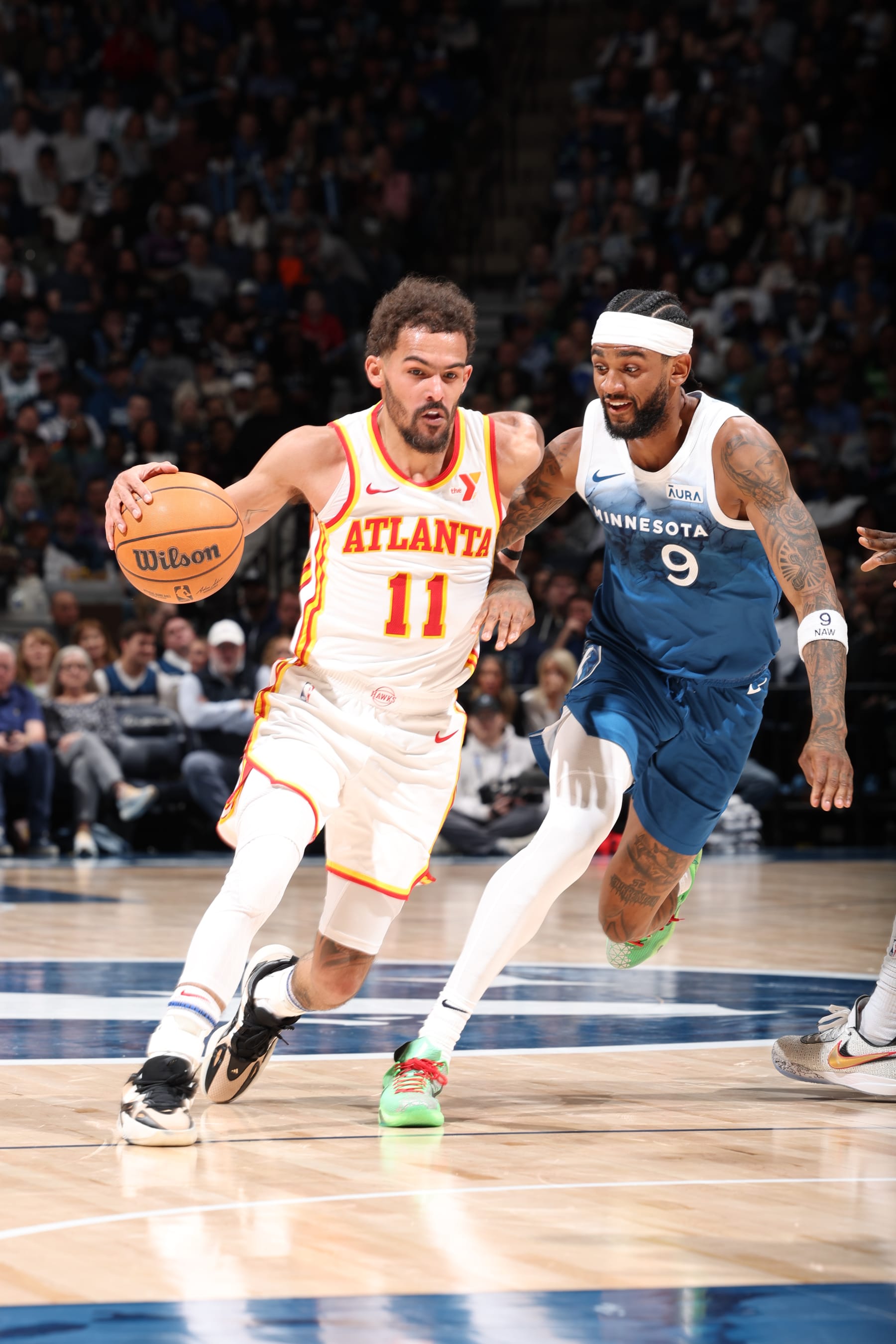MINNEAPOLIS, MN -  APRIL 12:  Trae Young #11 of the Atlanta Hawks handles the ball during the game against the Minnesota Timberwolves on April 12, 2024 at Target Center in Minneapolis, Minnesota. NOTE TO USER: User expressly acknowledges and agrees that, by downloading and or using this Photograph, user is consenting to the terms and conditions of the Getty Images License Agreement. Mandatory Copyright Notice: Copyright 2024 NBAE (Photo by David Sherman/NBAE via Getty Images)