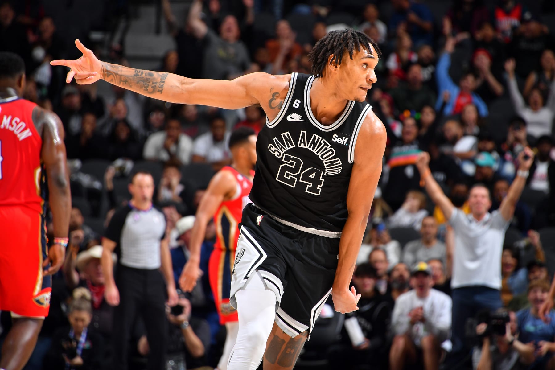 SAN ANTONIO, TX - DECEMBER 2: Devin Vassell #24 of the San Antonio Spurs celebrates a three point basket during the game against the New Orleans Pelicans on December 2, 2022 at the AT&T Center in San Antonio, Texas. NOTE TO USER: User expressly acknowledges and agrees that, by downloading and or using this photograph, user is consenting to the terms and conditions of the Getty Images License Agreement. Mandatory Copyright Notice: Copyright 2022 NBAE (Photos by Michael Gonzales/NBAE via Getty Images)
