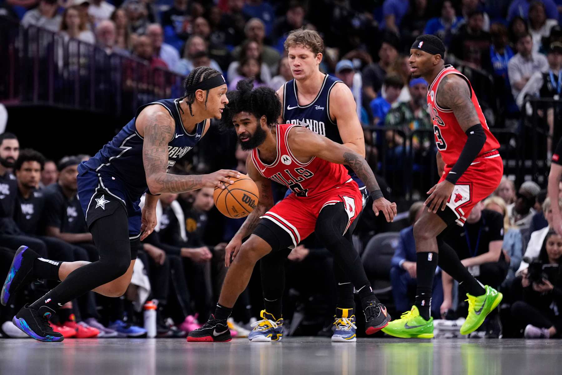 ORLANDO, FLORIDA - APRIL 07: Paolo Banchero #5 of the Orlando Magic dribbles the ball against Coby White #0 of the Chicago Bulls during the third quarter at Kia Center on April 07, 2024 in Orlando, Florida. NOTE TO USER: User expressly acknowledges and agrees that, by downloading and or using this photograph, User is consenting to the terms and conditions of the Getty Images License Agreement. (Photo by Rich Storry/Getty Images)