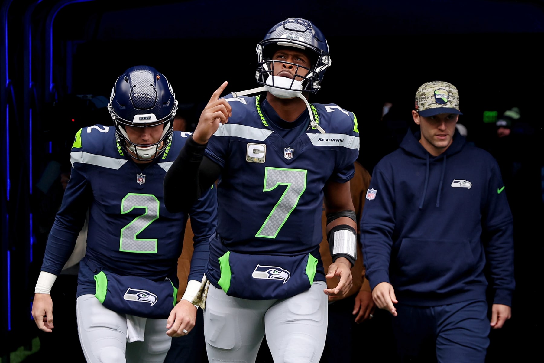 SEATTLE, WASHINGTON - NOVEMBER 12: Geno Smith #7 of the Seattle Seahawks runs onto the filed prior to a game against the Washington Commanders at Lumen Field on November 12, 2023 in Seattle, Washington. (Photo by Steph Chambers/Getty Images)