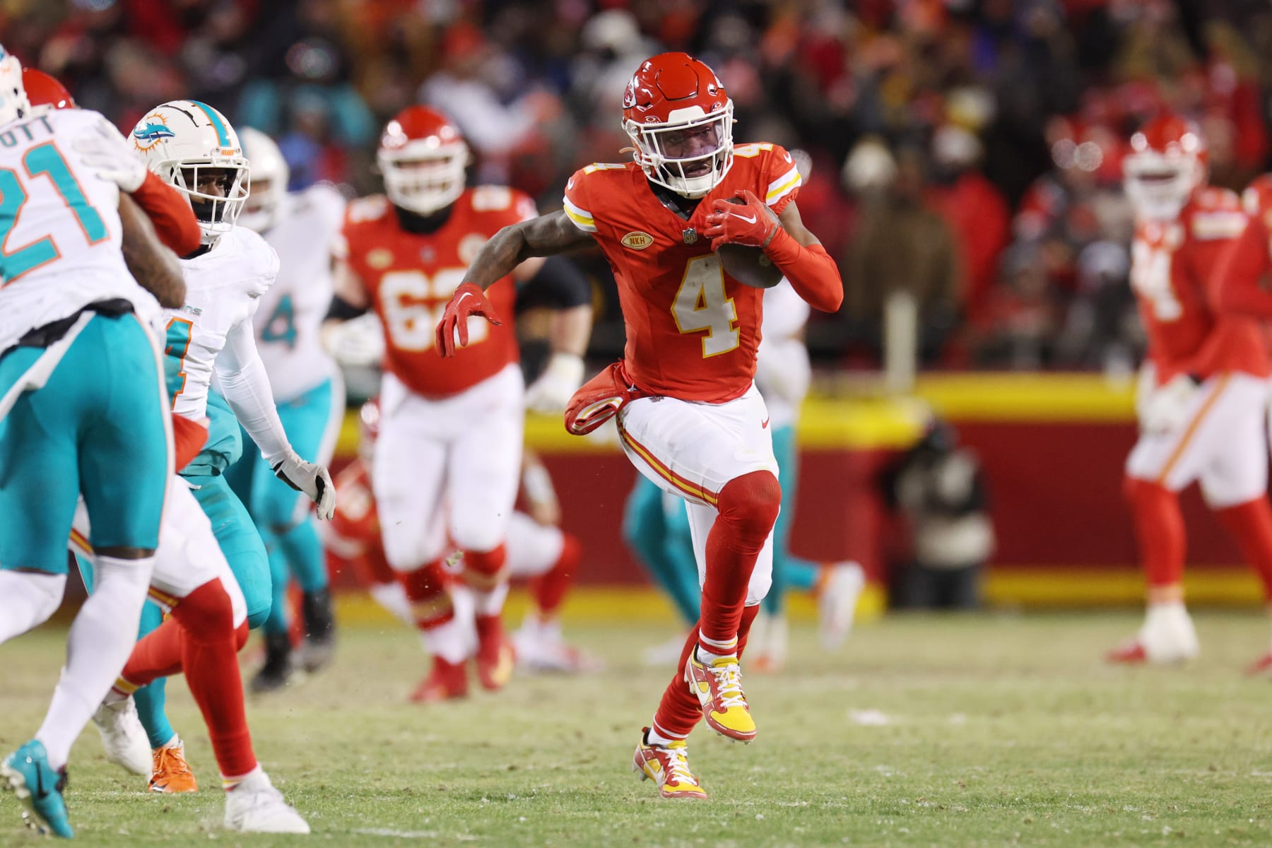 KANSAS CITY, MISSOURI - JANUARY 13: Rashee Rice #4 of the Kansas City Chiefs runs with the ball during the first half against the Miami Dolphins in the AFC Wild Card Playoffs at GEHA Field at Arrowhead Stadium on January 13, 2024 in Kansas City, Missouri. (Photo by Jamie Squire/Getty Images)