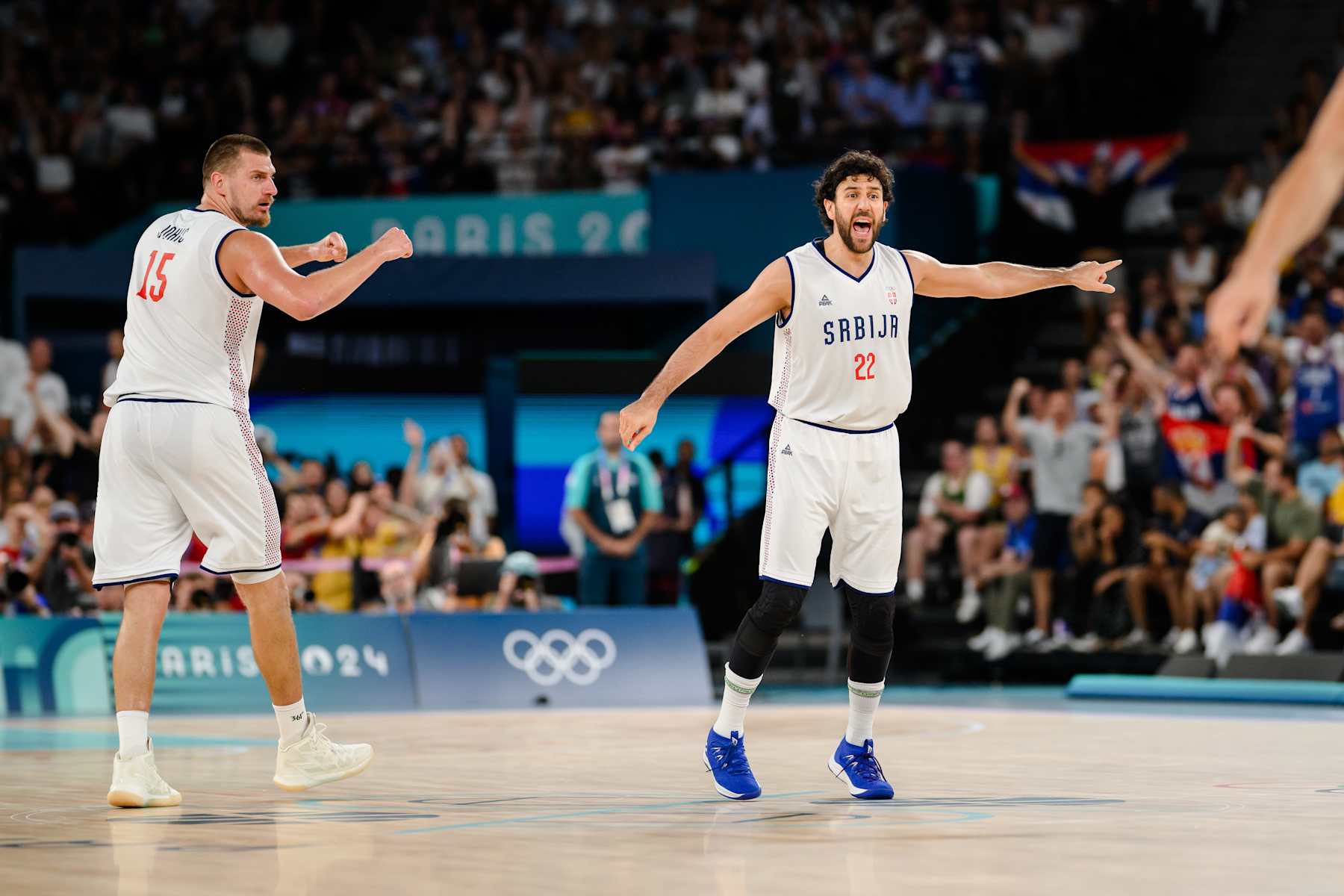 PARIS, FRANCE - AUGUST 06: Nikola Jokic (L) and Vasilije Micic of Serbia celebrating during the quarter final between Serbia and Australia on day eleven of the Olympic Games Paris 2024 at Bercy Arena on August 06, 2024 in Paris, France. (Photo by Marvin Ibo Guengoer - GES Sportfoto/Getty Images)