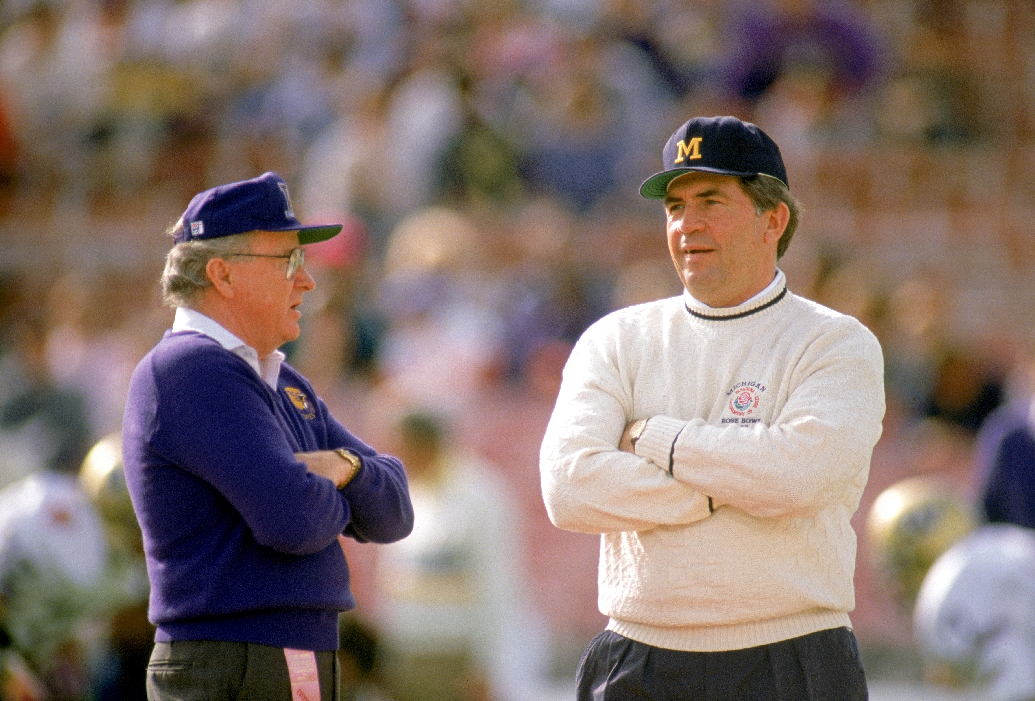 PASADENA, CA - JANUARY 1:  Head coach Don James of the Washington Huskies talks to head coach Gary Moeller of the Michigan Wolverines before the 1992 Rose Bowl at the Rose Bowl on January 1, 1992 in Pasadena, California. The Huskies defeated the Wolverines 34-14.  (Photo by Bernstein Associates/Getty Images)