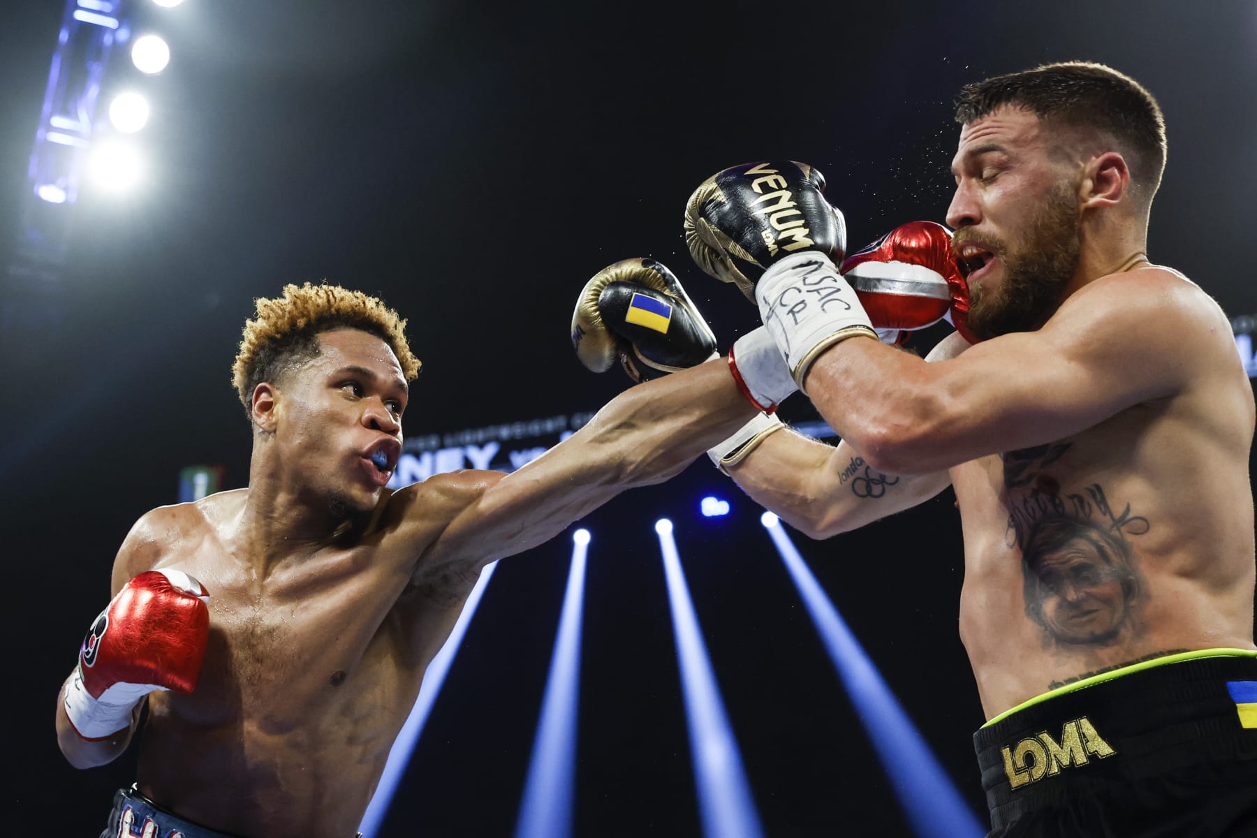 LAS VEGAS, NEVADA - MAY 20: Devin Haney punches Vasyl Lomachenko of Ukraine during their undisputed lightweight title bout at MGM Grand Garden Arena on May 20, 2023 in Las Vegas, Nevada. (Photo by Sarah Stier/Getty Images)