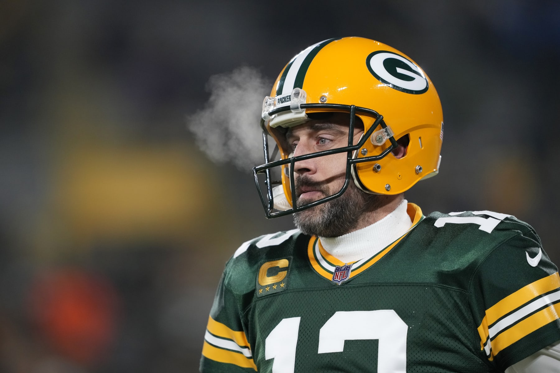 GREEN BAY, WISCONSIN - JANUARY 08: Aaron Rodgers #12 of the Green Bay Packers warms up before a game against the Detroit Lions at Lambeau Field on January 08, 2023 in Green Bay, Wisconsin. (Photo by Patrick McDermott/Getty Images)