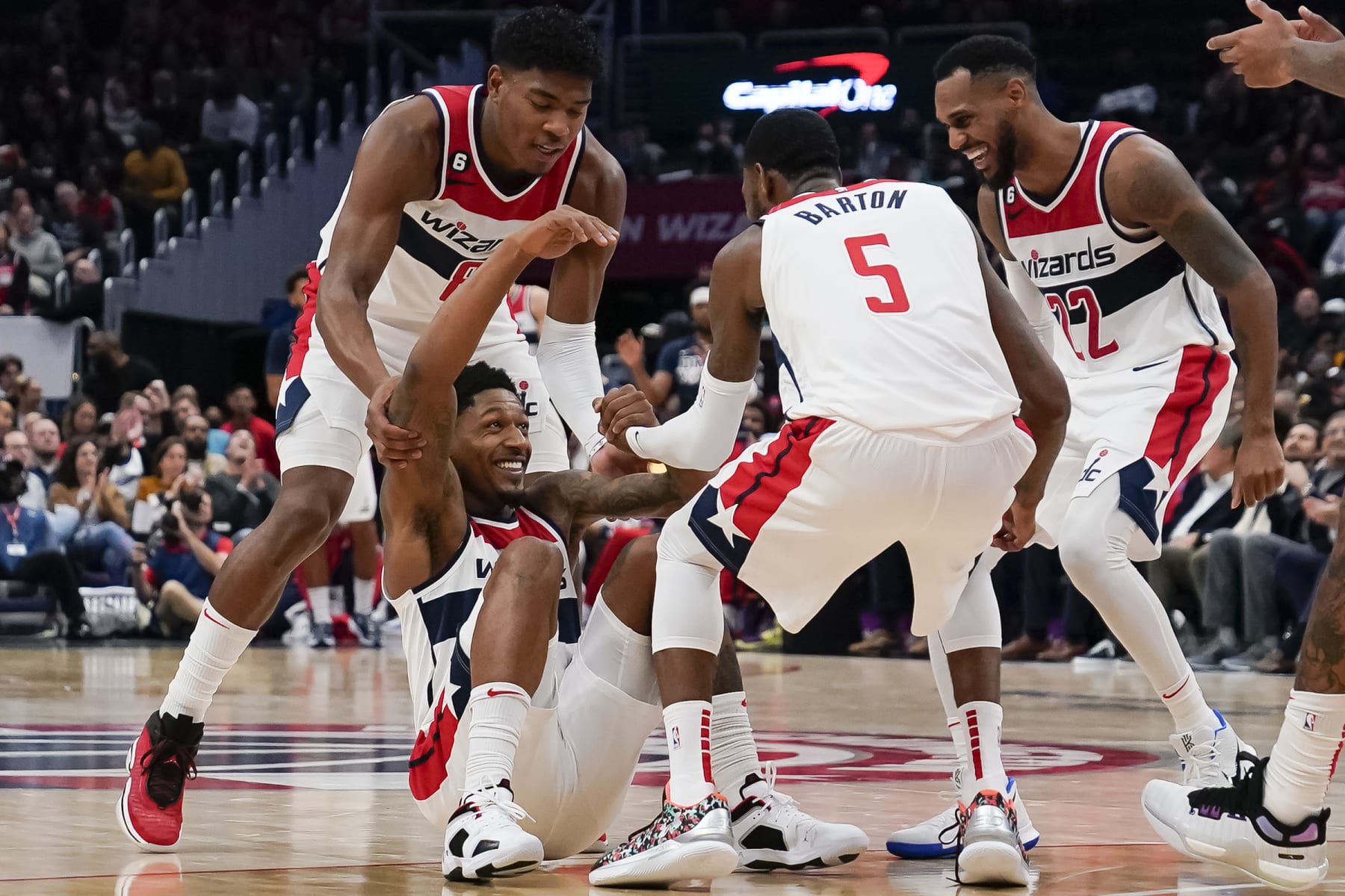 WASHINGTON, DC - OCTOBER 25: Rui Hachimura #8, Will Barton #5 and Monte Morris #22 give Bradley Beal #3 of the Washington Wizards a hand after he is fouled by the Detroit Pistons during the second half at Capital One Arena on October 25, 2022 in Washington, DC. NOTE TO USER: User expressly acknowledges and agrees that, by downloading and or using this photograph, User is consenting to the terms and conditions of the Getty Images License Agreement. (Photo by Jess Rapfogel/Getty Images)