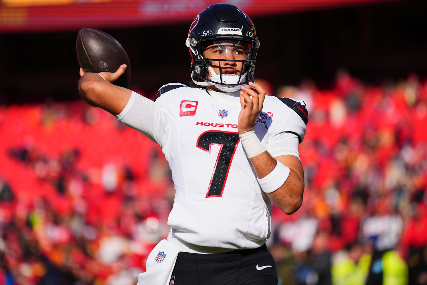 KANSAS CITY, MO - DECEMBER 21: C.J. Stroud #7 of the Houston Texans warms up before kickoff against the Kansas City Chiefs during an NFL football game at GEHA Field at Arrowhead Stadium on December 21, 2024 in Kansas City, Missouri. (Photo by Cooper Neill/Getty Images)