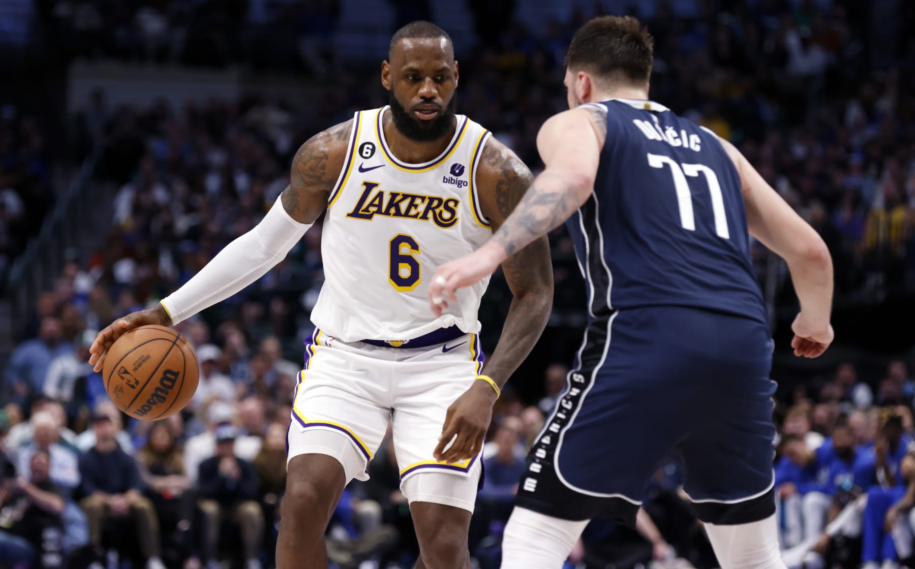 DALLAS, TX - FEBRUARY 26 : LeBron James #6 of the Los Angeles Lakers handles the ball as Luka Doncic #77 of the Dallas Mavericks defends in the second half at American Airlines Center on February 26, 2023 in Dallas, Texas. The Lakers won 111-108. NOTE TO USER: User expressly acknowledges and agrees that, by downloading and or using this photograph, User is consenting to the terms and conditions of the Getty Images License Agreement. (Photo by Ron Jenkins/Getty Images)