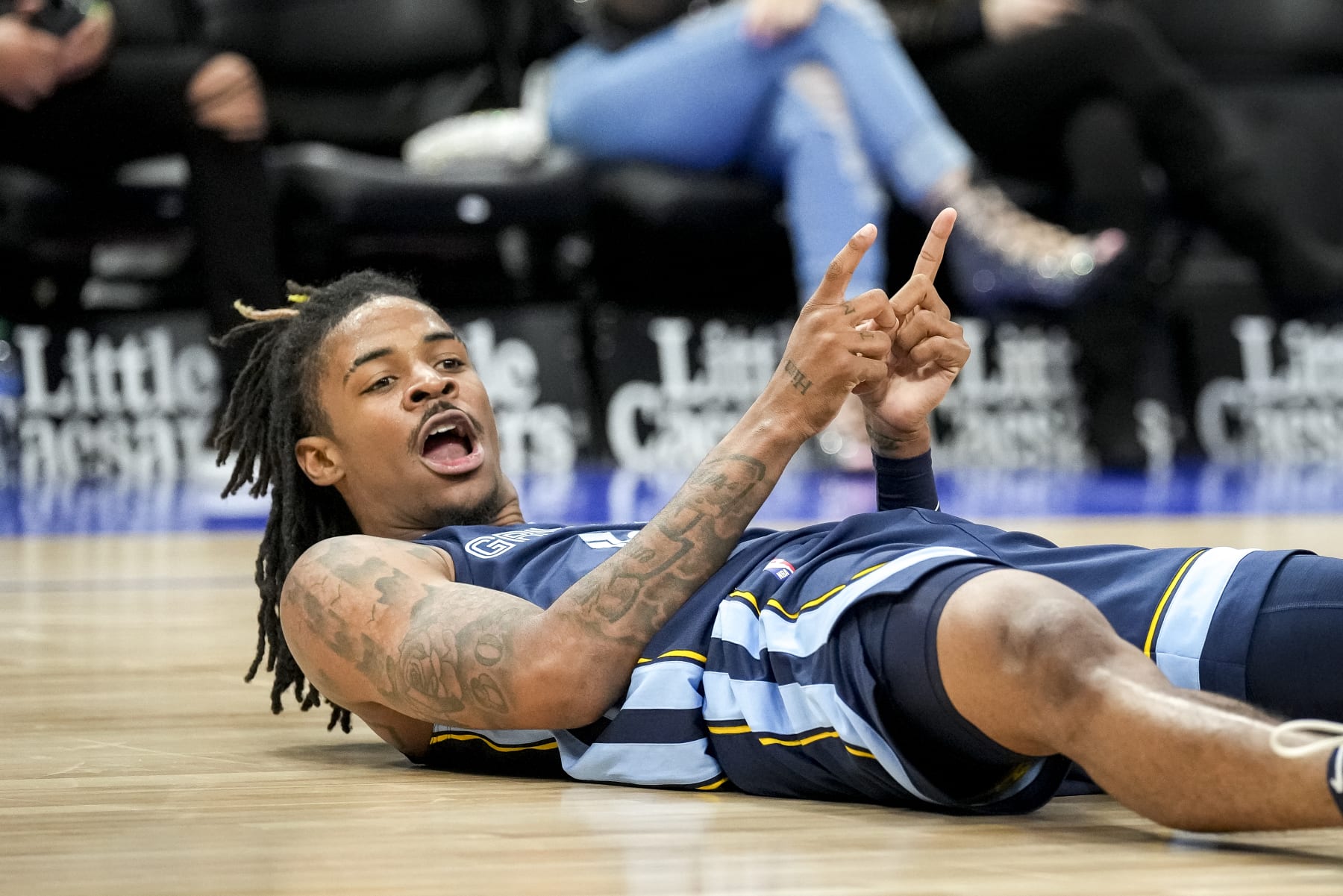 DETROIT, MICHIGAN - OCTOBER 13: Ja Morant #12 of the Memphis Grizzlies reacts against the Detroit Pistons during the third quarter at Little Caesars Arena on October 13, 2022 in Detroit, Michigan. NOTE TO USER: User expressly acknowledges and agrees that, by downloading and or using this photograph, User is consenting to the terms and conditions of the Getty Images License Agreement. (Photo by Nic Antaya/Getty Images)