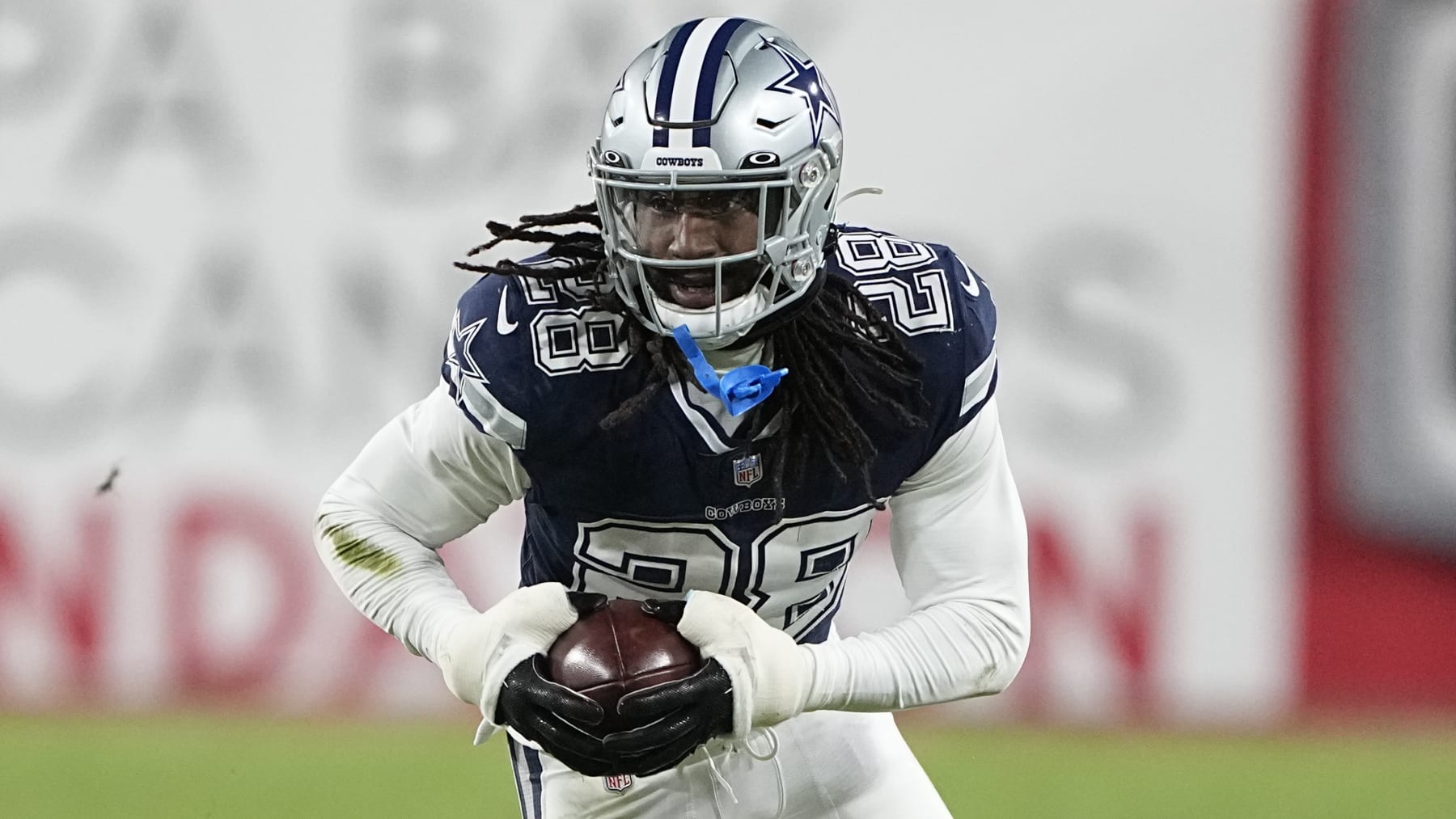 Dallas Cowboys safety Malik Hooker (28) runs after picking up a fumble against the Tampa Bay Buccaneers during the second half of an NFL wild-card football game, Monday, Jan. 16, 2023, in Tampa, Fla. The fumble was over ruled on a replay. (AP Photo/Chris Carlson)