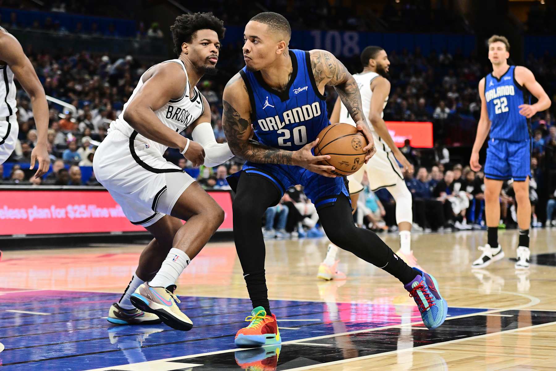 ORLANDO, FLORIDA - FEBRUARY 27: Markelle Fultz #20 of the Orlando Magic goes to the net against Dennis Smith Jr. #4 of the Brooklyn Nets in the first half of a game at Kia Center on February 27, 2024 in Orlando, Florida. NOTE TO USER: User expressly acknowledges and agrees that, by downloading and or using this photograph, User is consenting to the terms and conditions of the Getty Images License Agreement. (Photo by Julio Aguilar/Getty Images)