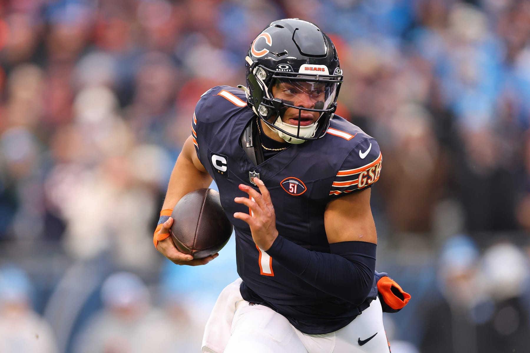CHICAGO, ILLINOIS - DECEMBER 10: Justin Fields #1 of the Chicago Bears runs with the ball against the Detroit Lions during the first quarter at Soldier Field on December 10, 2023 in Chicago, Illinois. (Photo by Michael Reaves/Getty Images)