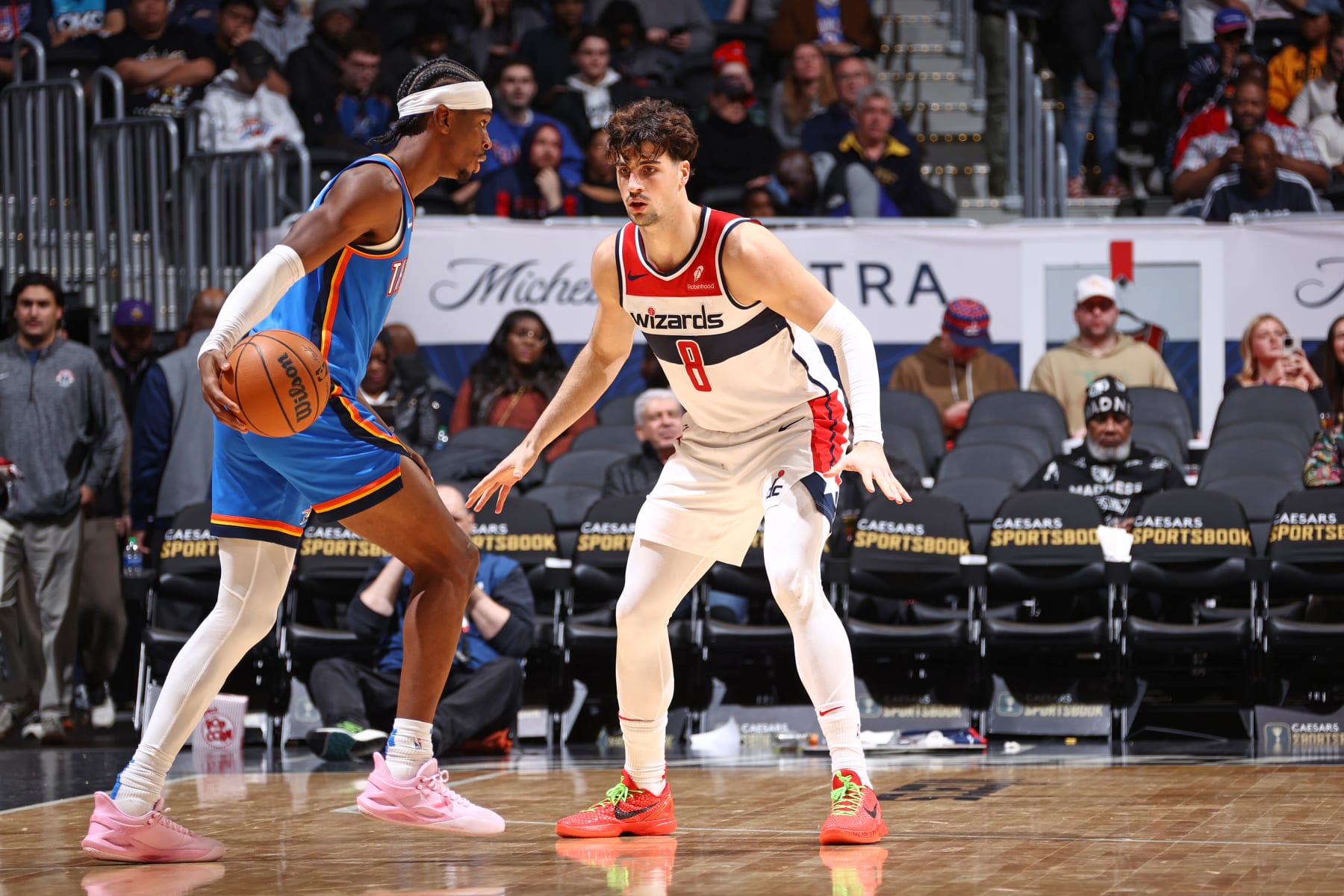 WASHINGTON, DC -  JANUARY 8: Deni Avdija #8 of the Washington Wizards plays defense against Shai Gilgeous-Alexander #2 of the Oklahoma City Thunder during the game on January 8, 2024 at Capital One Arena in Washington, DC. NOTE TO USER: User expressly acknowledges and agrees that, by downloading and or using this Photograph, user is consenting to the terms and conditions of the Getty Images License Agreement. Mandatory Copyright Notice: Copyright 2024 NBAE (Photo by Kenny Giarla/NBAE via Getty Images)