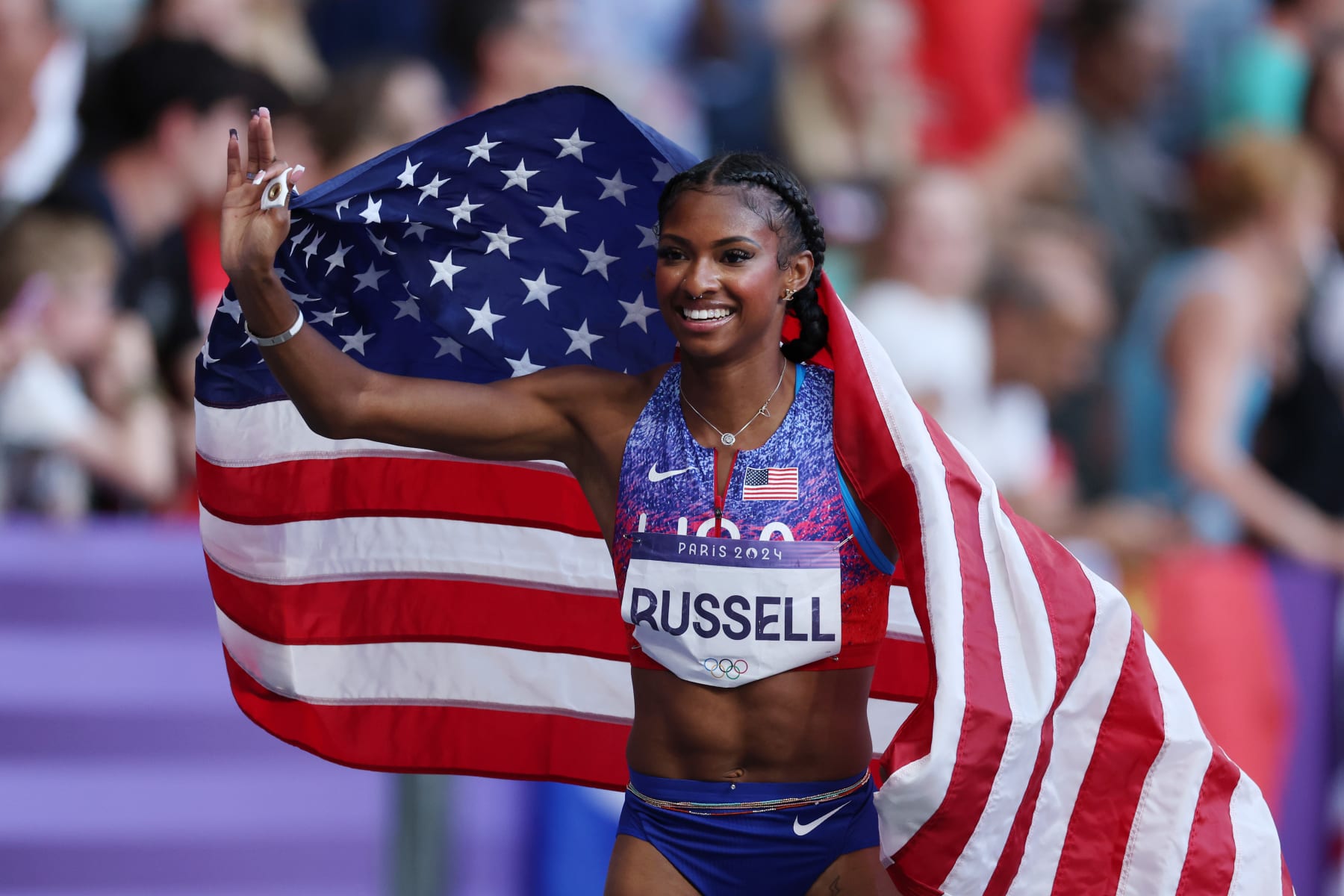 PARIS, FRANCE - AUGUST 10: Masai Russell of Team United States celebrates winning the Gold medal in the Women's 100m Hurdles Final on day fifteen of the Olympic Games Paris 2024 at Stade de France on August 10, 2024 in Paris, France. (Photo by Al Bello/Getty Images)