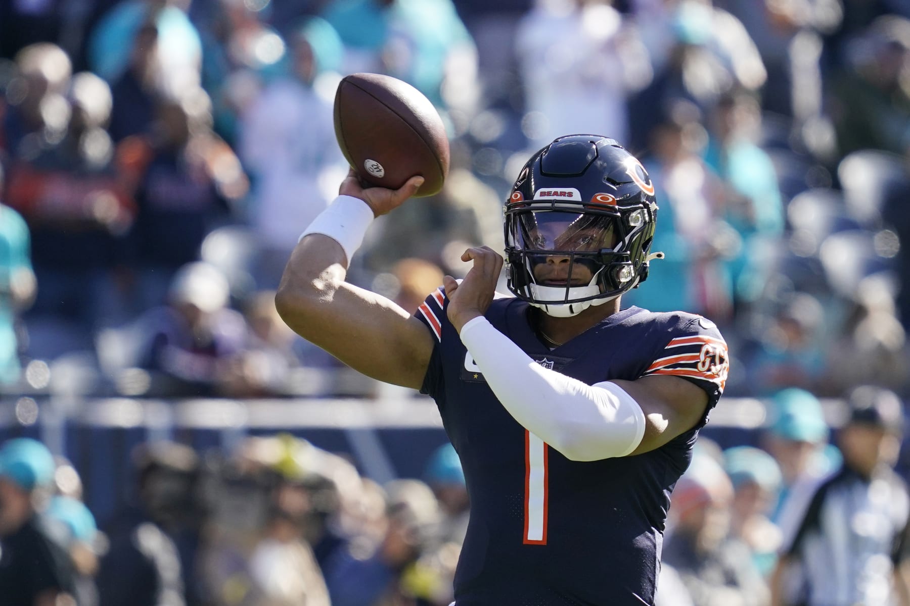 Chicago Bears quarterback Justin Fields warms up before the start of an NFL football game against the Miami Dolphins, Sunday, Nov. 6, 2022 in Chicago. (AP Photo/Nam Y. Huh)