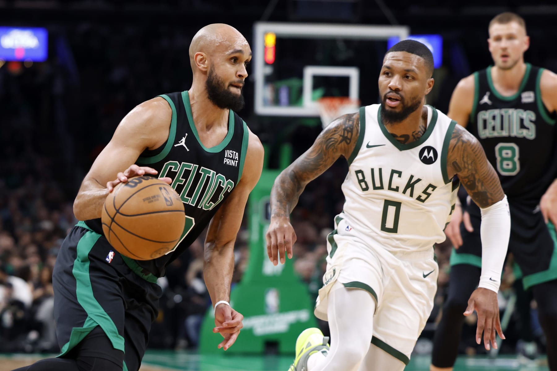 Boston, MA - November 22: Boston Celtics PG Derrick White drives to the basket in the first quarter. The Celtics beat the Milwaukee Bucks, 119-116. (Photo by Danielle Parhizkaran/The Boston Globe via Getty Images)