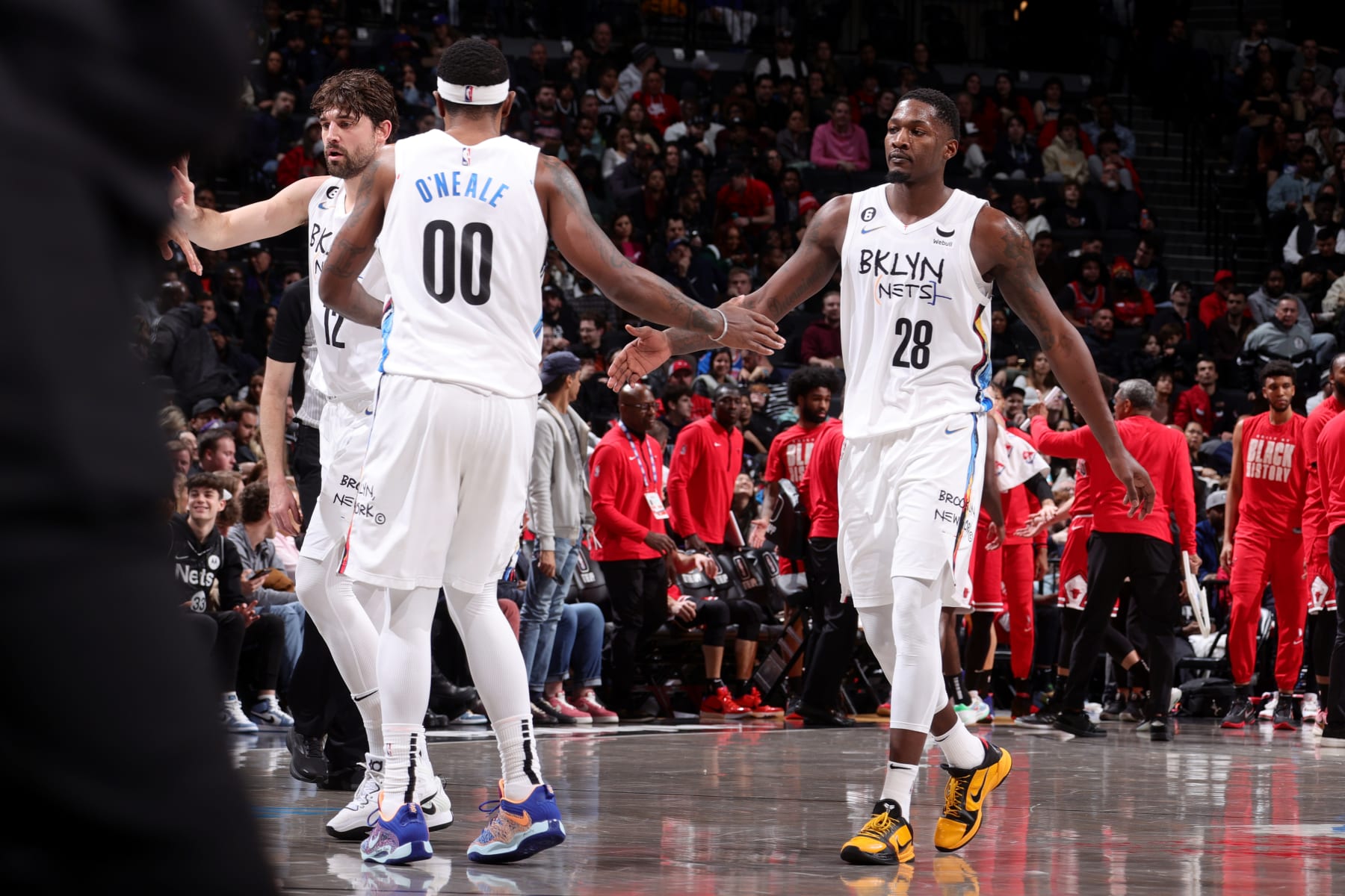 BROOKLYN, NY - FEBRUARY 9: Dorian Finney-Smith #28 of the Brooklyn Nets high fives Royce O'Neale #00 of the Brooklyn Nets during the game against the Atlanta Hawks on February 9, 2023 at Barclays Center in Brooklyn, New York. NOTE TO USER: User expressly acknowledges and agrees that, by downloading and or using this Photograph, user is consenting to the terms and conditions of the Getty Images License Agreement. Mandatory Copyright Notice: Copyright 2023 NBAE (Photo by Nathaniel S. Butler/NBAE via Getty Images)