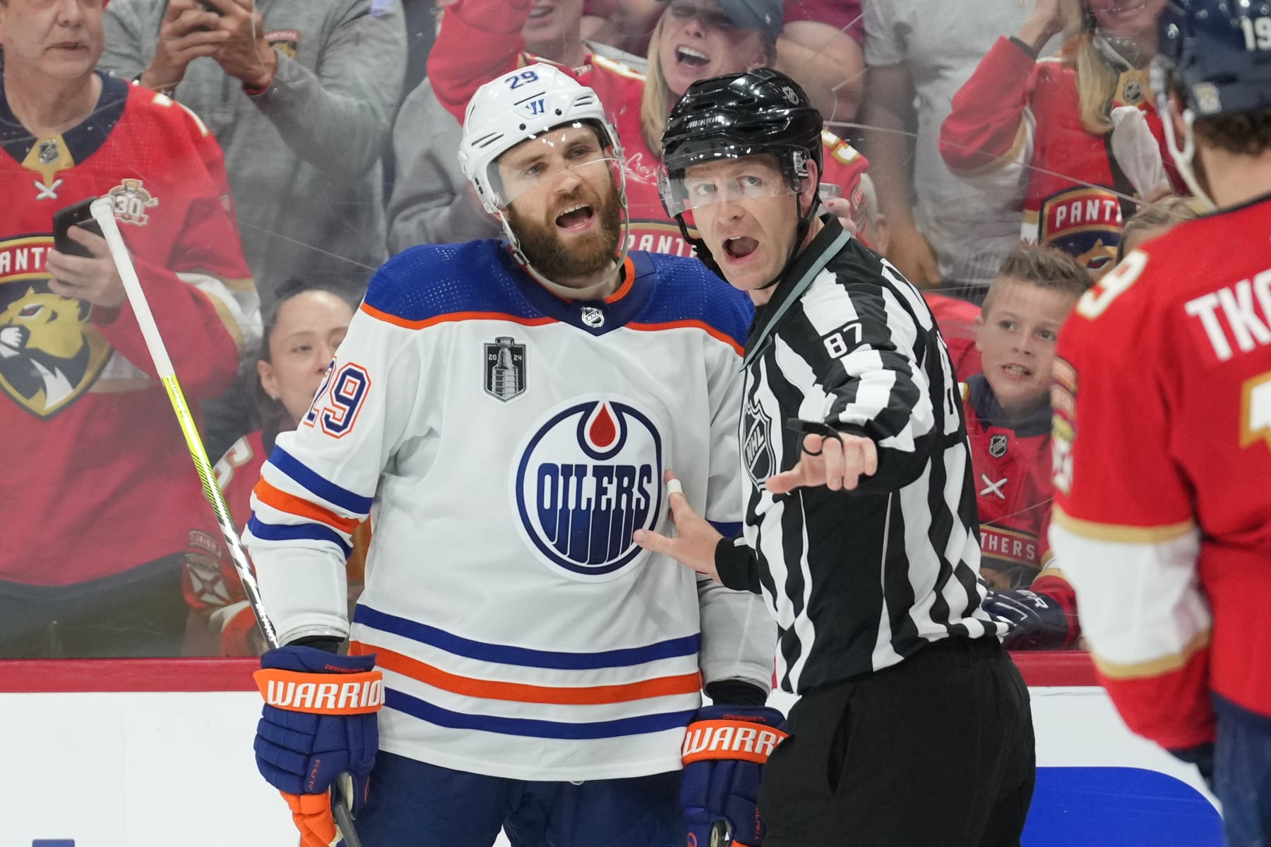 SUNRISE, FL - JUNE 10: linesman Devin Berg (87) tries to keep Edmonton Oilers center Leon Draisaitl (29) from Florida Panthers left wing Matthew Tkachuk (19) in the third period during game two of the Stanley Cup Finals between the Edmonton Oilers and the Florida Panthers on Saturday, June 10, 2024 at Amerant Bank Area in Sunrise, Fla. (Photo by Peter Joneleit/Icon Sportswire via Getty Images)