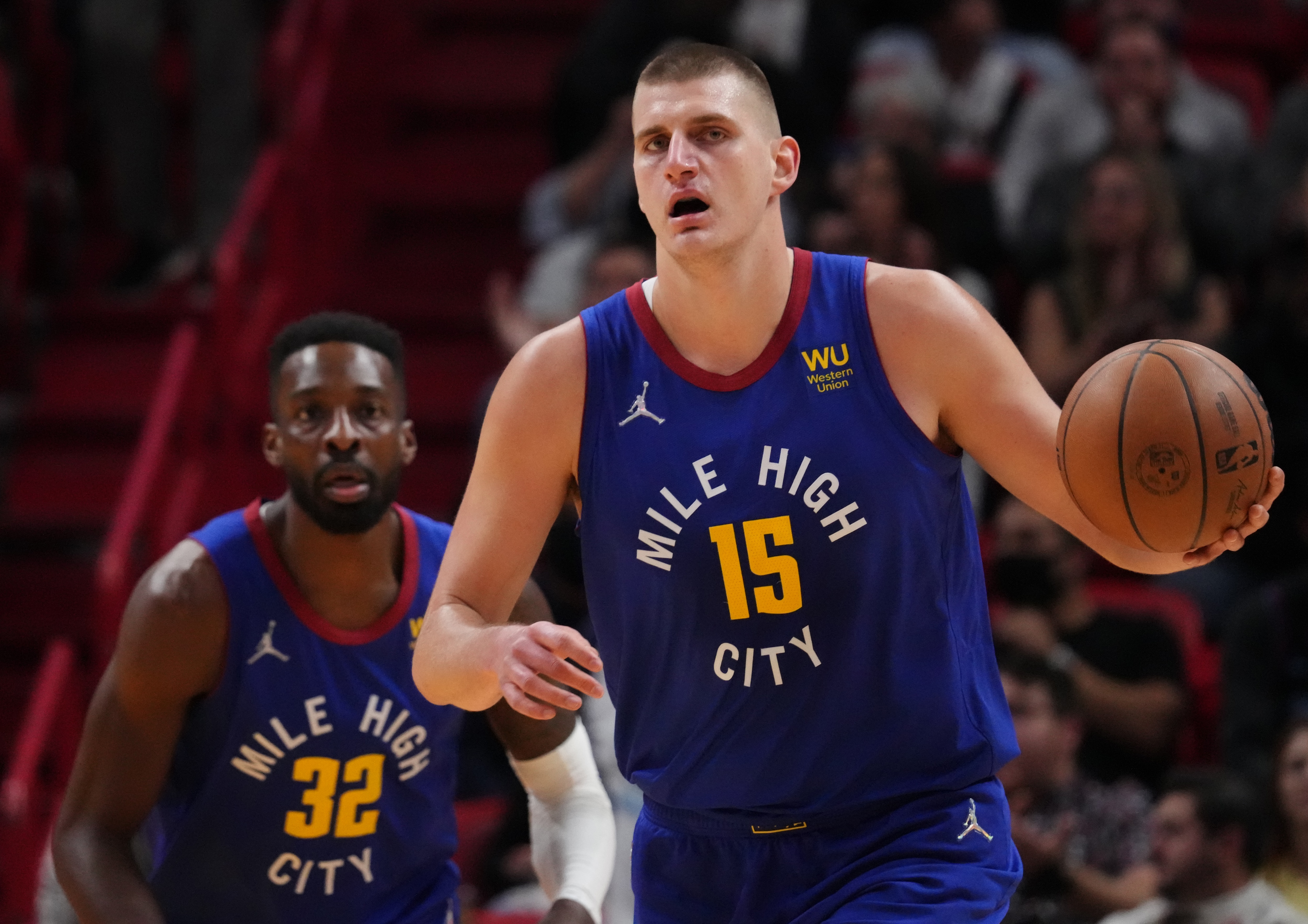 MIAMI, FLORIDA - NOVEMBER 29: Nikola Jokic #15 of the Denver Nuggets dribbles the ball up the court against the Miami Heat during the first half at FTX Arena on November 29, 2021 in Miami, Florida. NOTE TO USER: User expressly acknowledges and agrees that, by downloading and or using this photograph, User is consenting to the terms and conditions of the Getty Images License Agreement. (Photo by Mark Brown/Getty Images)