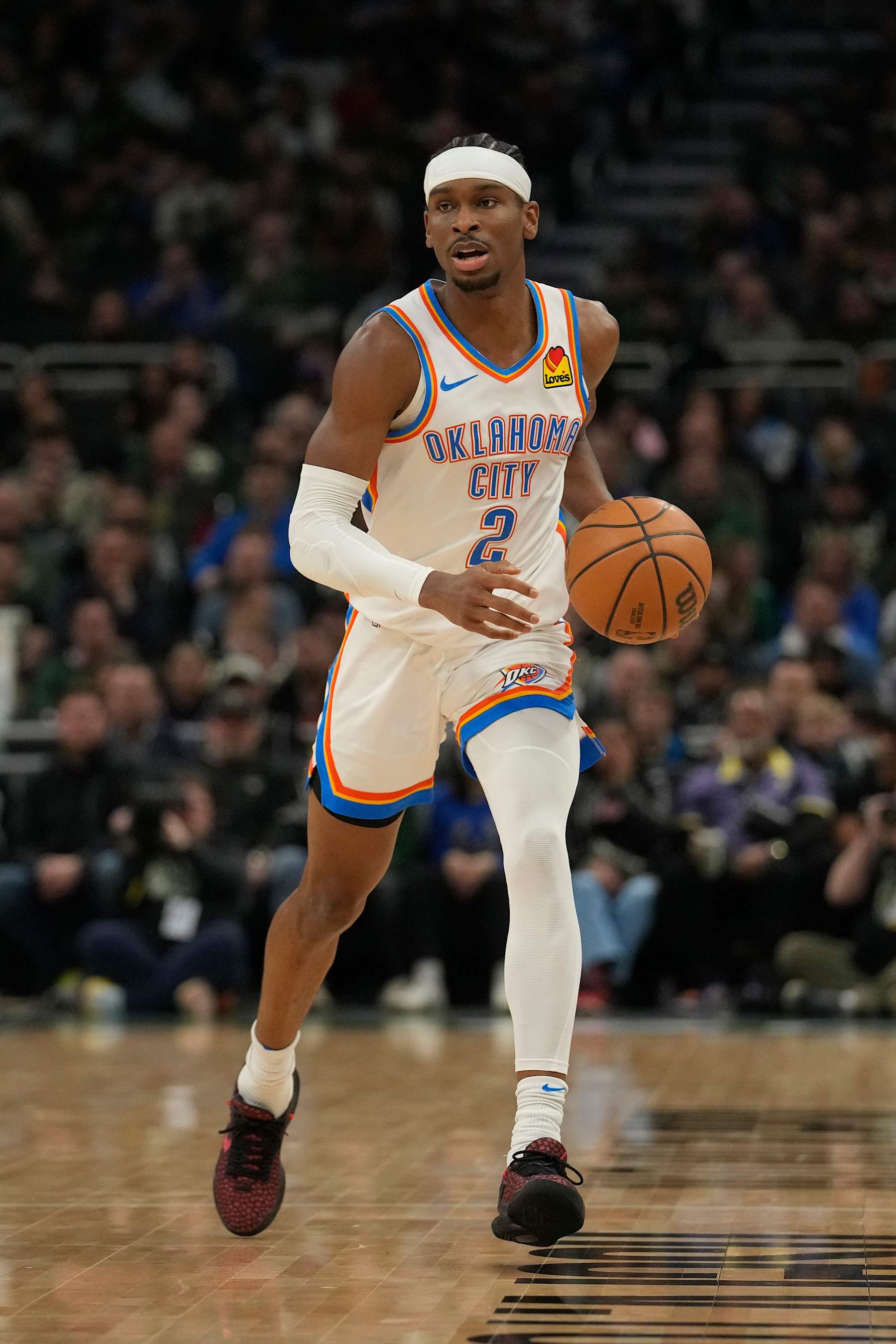MILWAUKEE, WISCONSIN - MARCH 24: Shai Gilgeous-Alexander #2 of the Oklahoma City Thunder dribbles the ball during the first half against the Milwaukee Bucks at Fiserv Forum on March 24, 2024 in Milwaukee, Wisconsin. NOTE TO USER: User expressly acknowledges and agrees that, by downloading and or using this photograph, User is consenting to the terms and conditions of the Getty Images License Agreement. (Photo by Patrick McDermott/Getty Images)