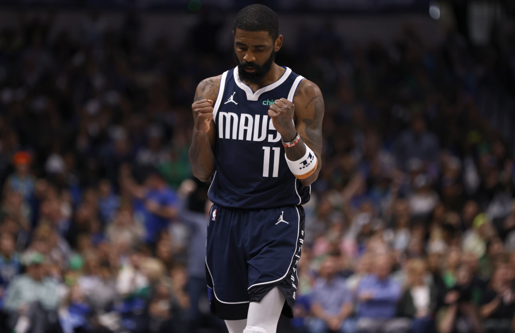 DALLAS, TX - MARCH 17: Kyrie Irving #11 of the Dallas Mavericks reacts late in the game against the Denver Nuggets  in the second half at American Airlines Center on March 17, 2024 in Dallas, Texas. NOTE TO USER: User expressly acknowledges and agrees that, by downloading and or using this photograph, User is consenting to the terms and conditions of the Getty Images License Agreement. (Photo by Ron Jenkins/Getty Images)