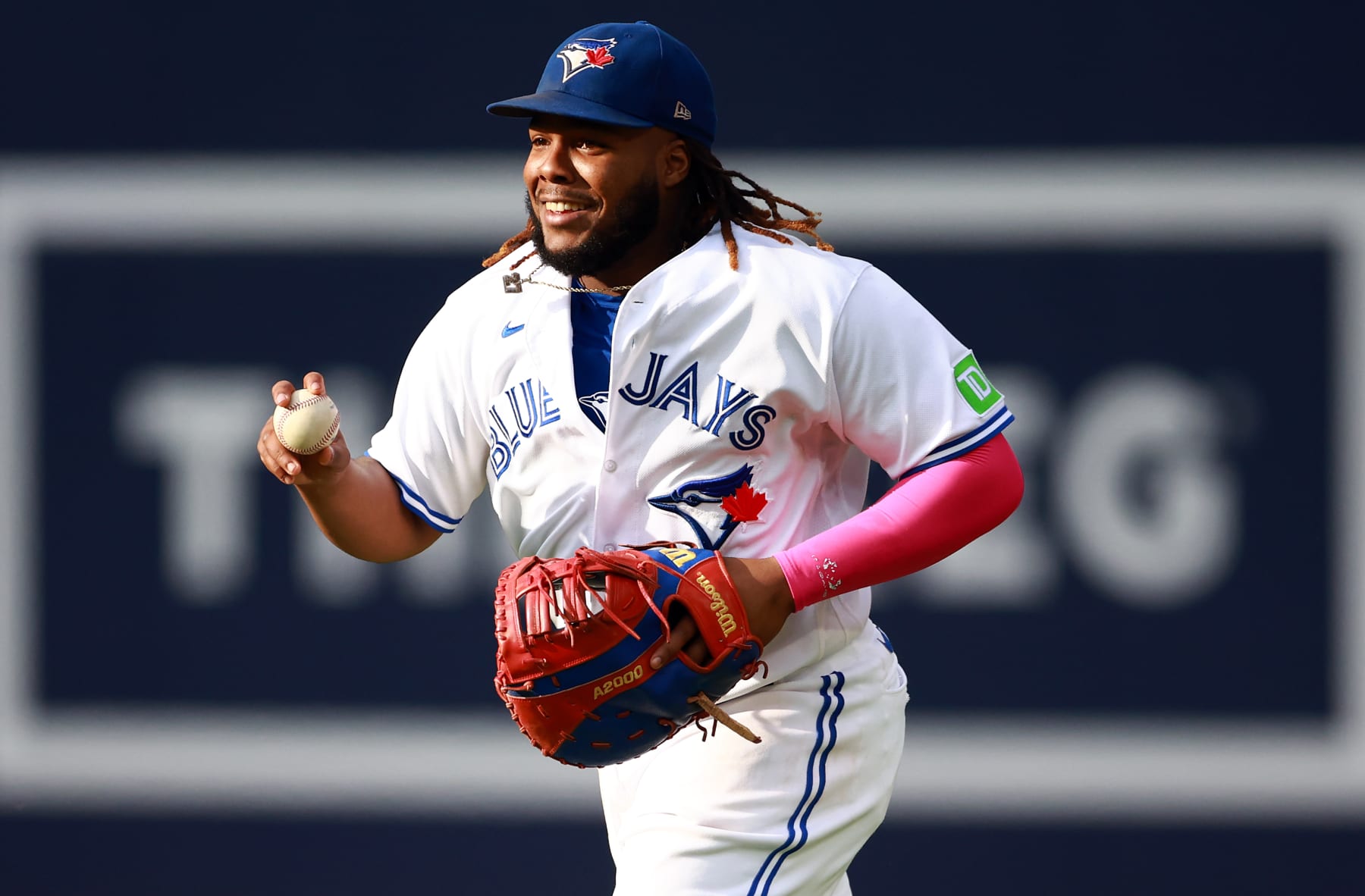 TORONTO, ON - SEPTEMBER 16:  Vladimir Guerrero Jr. #27 of the Toronto Blue Jays reacts after catching Justin Turner #2 of the Boston Red Sox out in the seventh inning at Rogers Centre on September 16, 2023 in Toronto, Ontario, Canada.  (Photo by Vaughn Ridley/Getty Images)