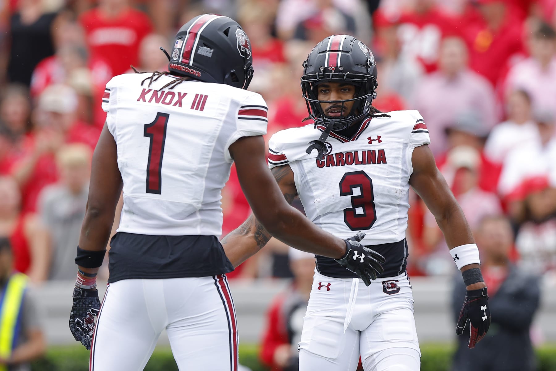 ATHENS, GEORGIA - SEPTEMBER 16: Antwane Wells Jr. #3 reacts with Trey Knox #1 of the South Carolina Gamecocks after his touchdown during the first quarter against the Georgia Bulldogs at Sanford Stadium on September 16, 2023 in Athens, Georgia. (Photo by Todd Kirkland/Getty Images)