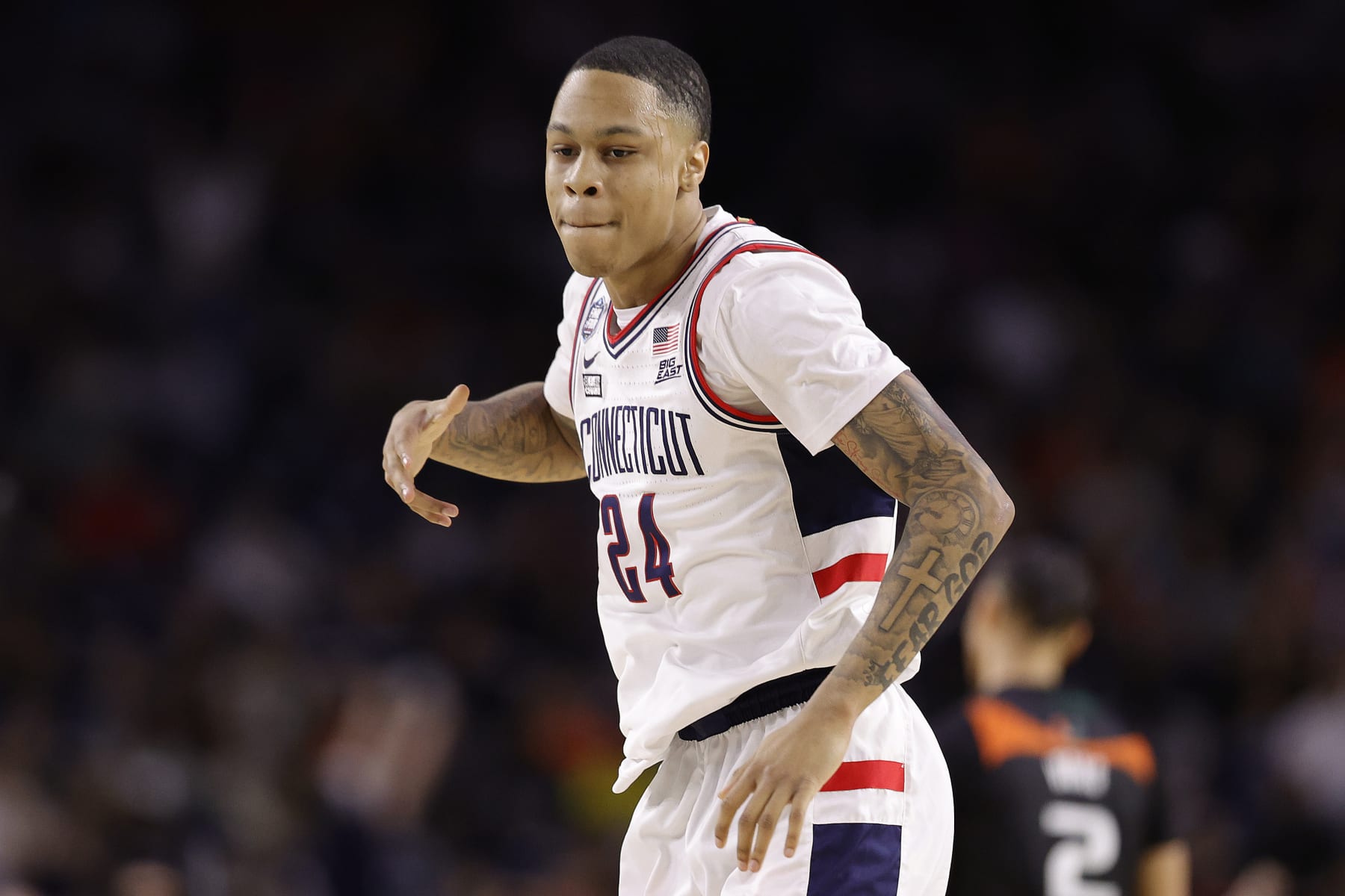 HOUSTON, TEXAS - APRIL 01: Jordan Hawkins #24 of the Connecticut Huskies reacts during the second half against the Miami Hurricanes during the NCAA Men's Basketball Tournament Final Four semifinal game at NRG Stadium on April 01, 2023 in Houston, Texas. (Photo by Carmen Mandato/Getty Images)