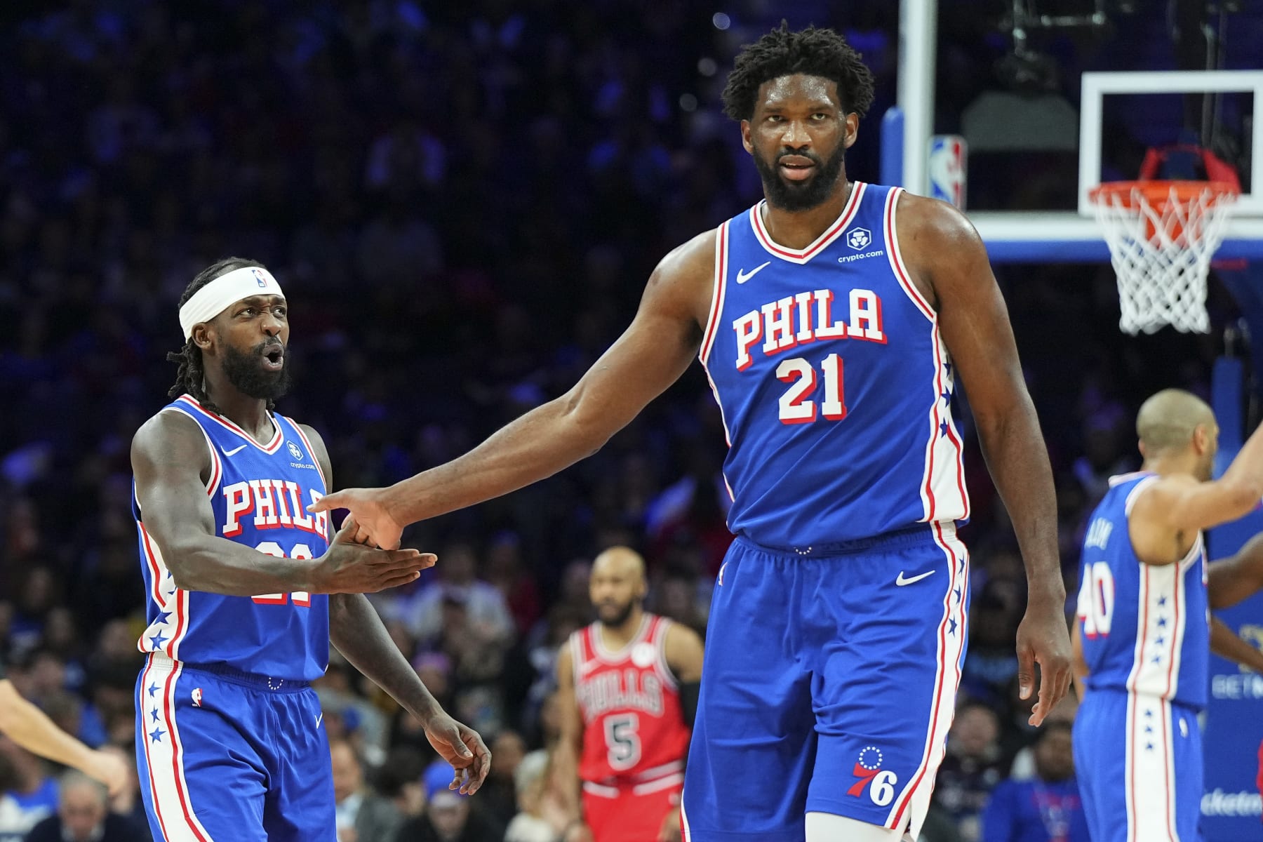 PHILADELPHIA, PENNSYLVANIA - JANUARY 2: Patrick Beverley #22 of the Philadelphia 76ers celebrates with Joel Embiid #21 against the Chicago Bulls in the first quarter at the Wells Fargo Center on January 2, 2024 in Philadelphia, Pennsylvania. NOTE TO USER: User expressly acknowledges and agrees that, by downloading and or using this photograph, User is consenting to the terms and conditions of the Getty Images License Agreement. (Photo by Mitchell Leff/Getty Images)