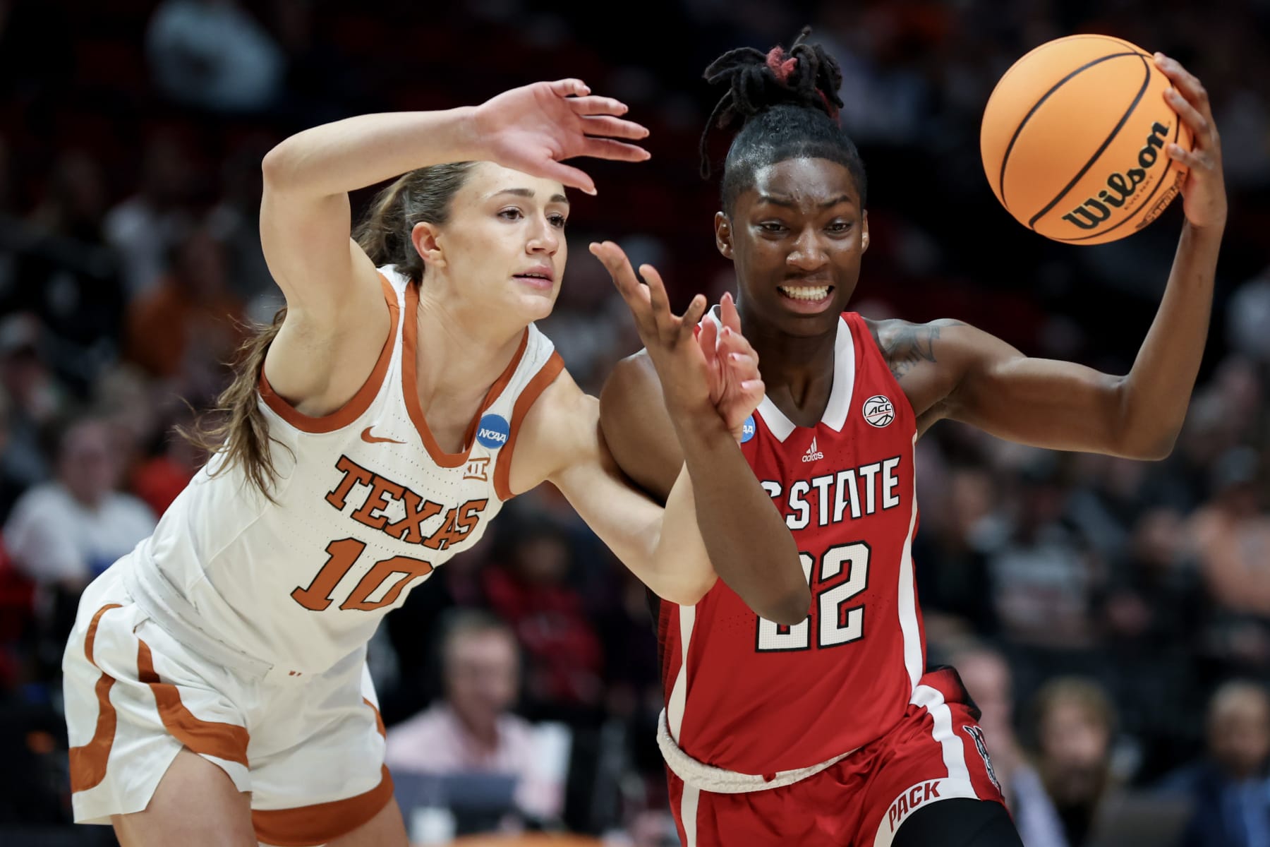 PORTLAND, OREGON - MARCH 31: Shay Holle #10 of the Texas Longhorns defends Saniya Rivers #22 of the NC State Wolfpack during the first half in the Elite 8 round of the NCAA Women's Basketball Tournament at Moda Center on March 31, 2024 in Portland, Oregon. (Photo by Steph Chambers/Getty Images)