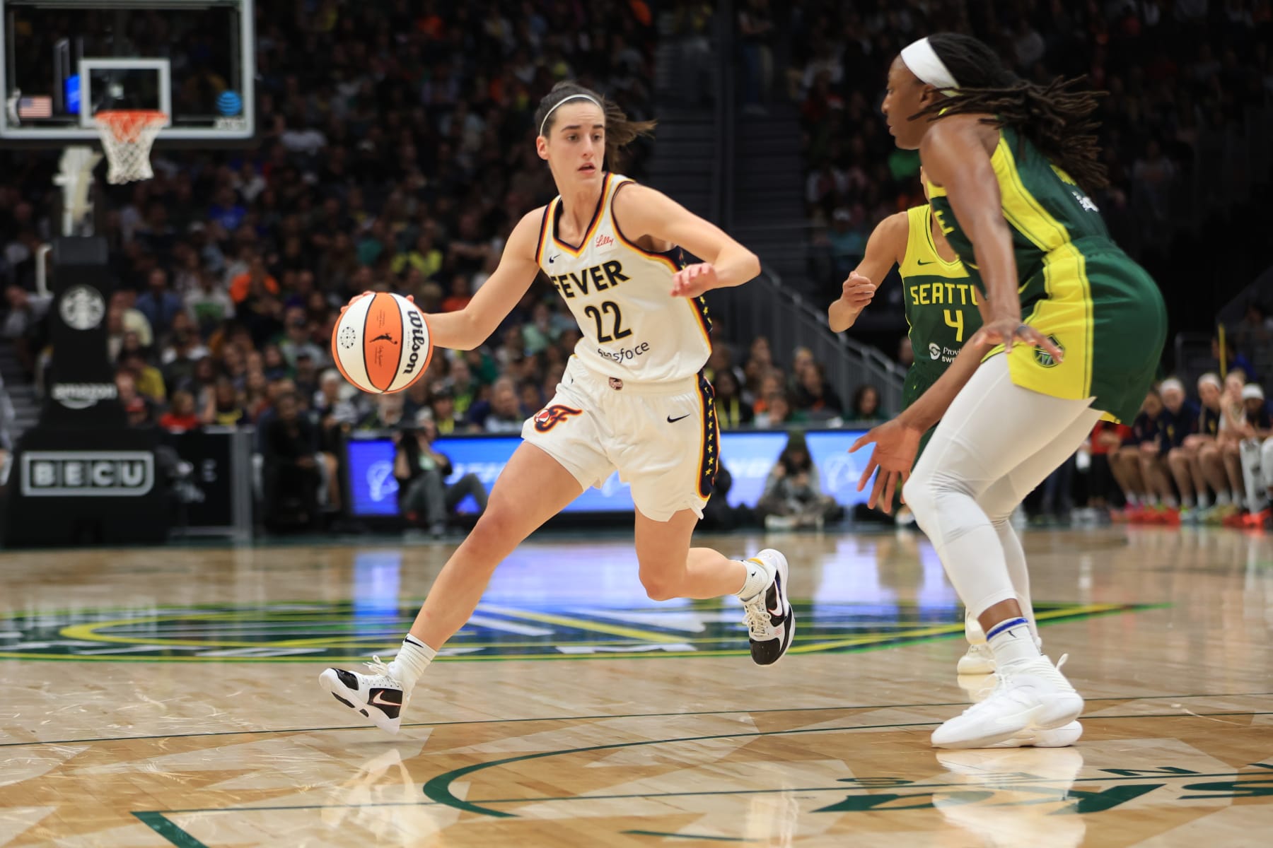 SEATTLE, WA - MAY 22: Caitlin Clark #22 of the Indiana Fever dribbles the ball during the game against the Seattle Storm on May 22, 2024 at Climate Pledge Arena in Seattle, Washington. NOTE TO USER: User expressly acknowledges and agrees that, by downloading and or using this photograph, User is consenting to the terms and conditions of the Getty Images License Agreement. Mandatory Copyright Notice: Copyright 2024 NBAE (Photo by Scott Eklund/NBAE via Getty Images)