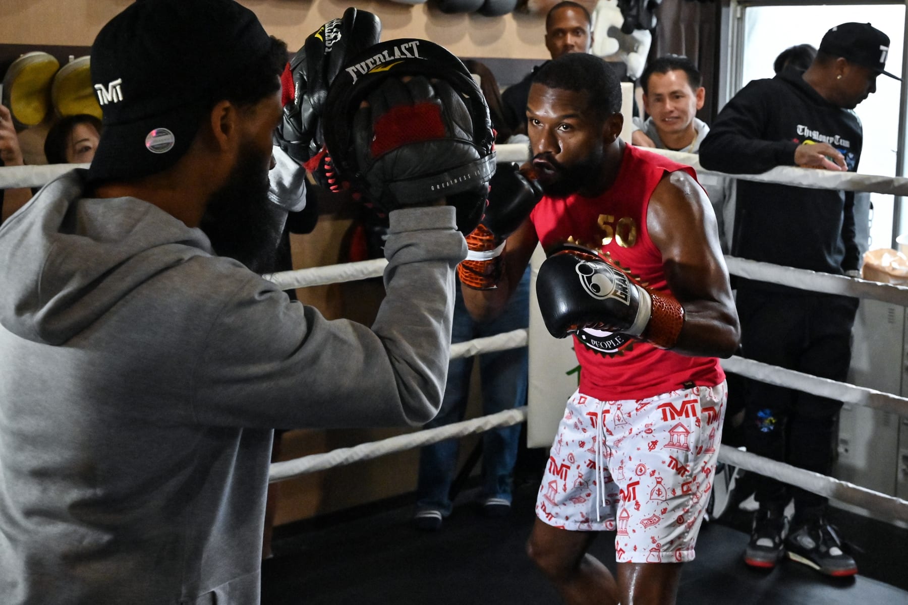 US boxer great Floyd Mayweather (R) takes part in a training session at a gym in Tokyo on September 22, 2022, ahead of his planned exhibition boxing match against Japanese mixed martial artist Mikuru Asakura on September 25. (Photo by Richard A. Brooks / AFP) (Photo by RICHARD A. BROOKS/AFP via Getty Images)