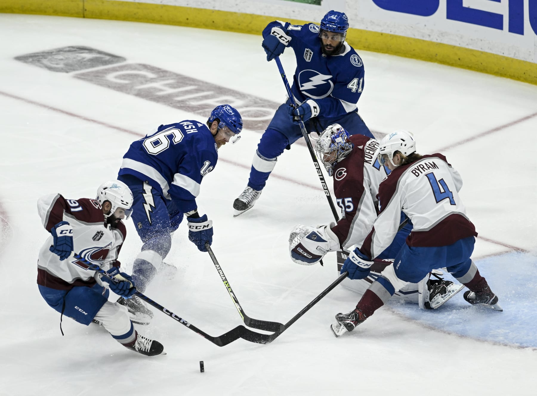 TAMPA , CO - JUNE 26: Nazem Kadri (91)Bowen Byram (4) and Darcy Kuemper (35) of the Colorado Avalanche vie for control against Riley Nash (16) and Pierre-Edouard Bellemare (41) of the Tampa Bay Lightning during the first period at Amalie Arena in Tampa on Sunday, June 26, 2022. The Colorado Avalanche versus the Tampa Bay Lightning in game six of the Stanley Cup Finals. (Photo by AAron Ontiveroz/MediaNews Group/The Denver Post via Getty Images)