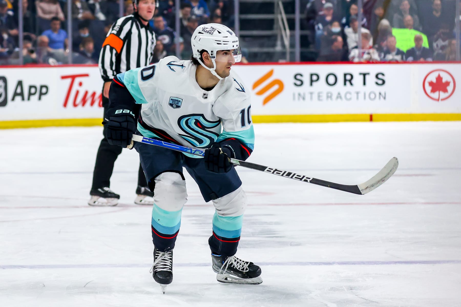 WINNIPEG, MB - MAY 01: Matty Beniers #10 of the Seattle Kraken follows the play up the ice during first period action against the Winnipeg Jets at Canada Life Centre on May 01, 2022 in Winnipeg, Manitoba, Canada. (Photo by Jonathan Kozub/NHLI via Getty Images)