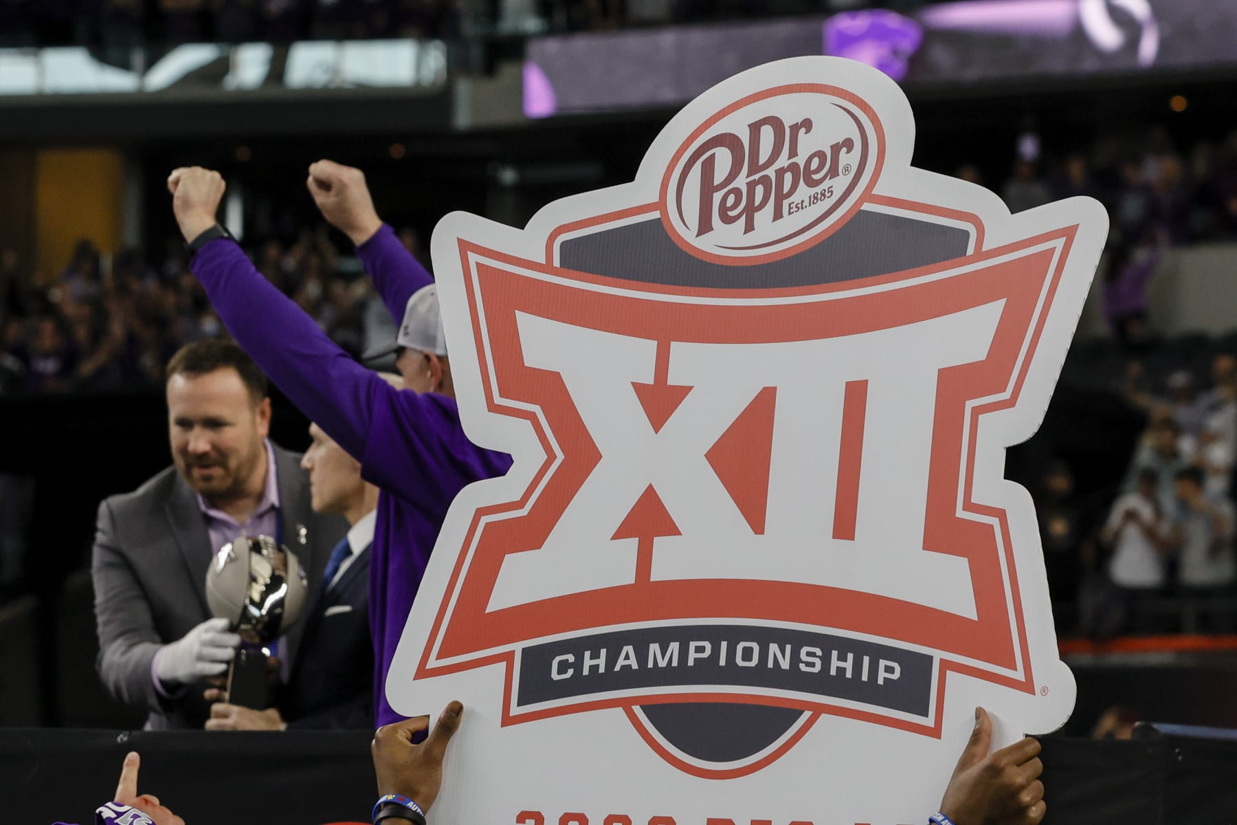 ARLINGTON, TX - DECEMBER 03: Kansas State Wildcats players hold up a BIG 12 sign after winning the BIG 12 Championship game between the TCU Horned Frogs and the Kansas State Wildcats on December 3, 2022 at AT&T Stadium in Arlington, Texas. (Photo by Matthew Pearce/Icon Sportswire via Getty Images)