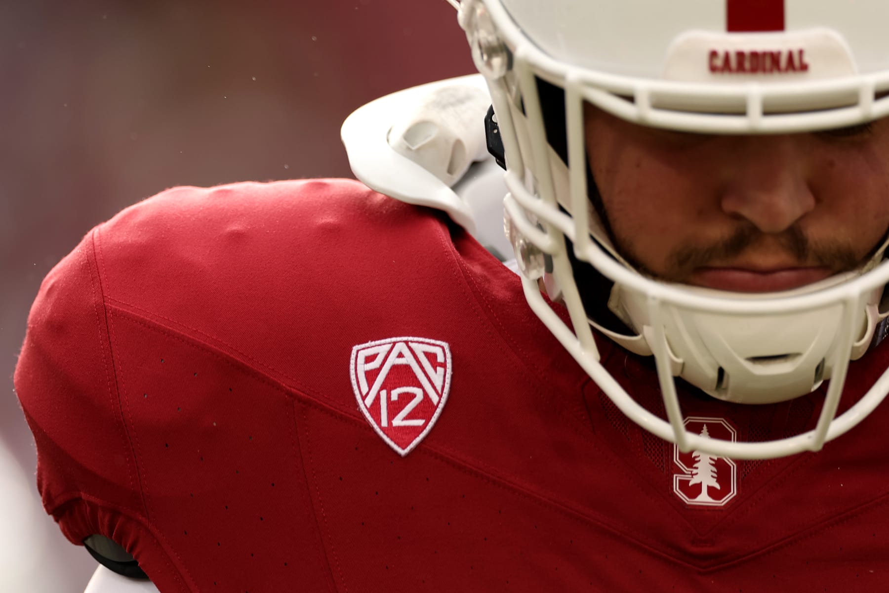 STANFORD, CALIFORNIA - NOVEMBER 18: Offensive lineman Alec Bank #58 of the Stanford Cardinal wears a Pac-12 logo on his jersey during warm-ups before their game against the California Golden Bearsat Stanford Stadium on November 18, 2023 in Stanford, California. (Photo by Ezra Shaw/Getty Images)