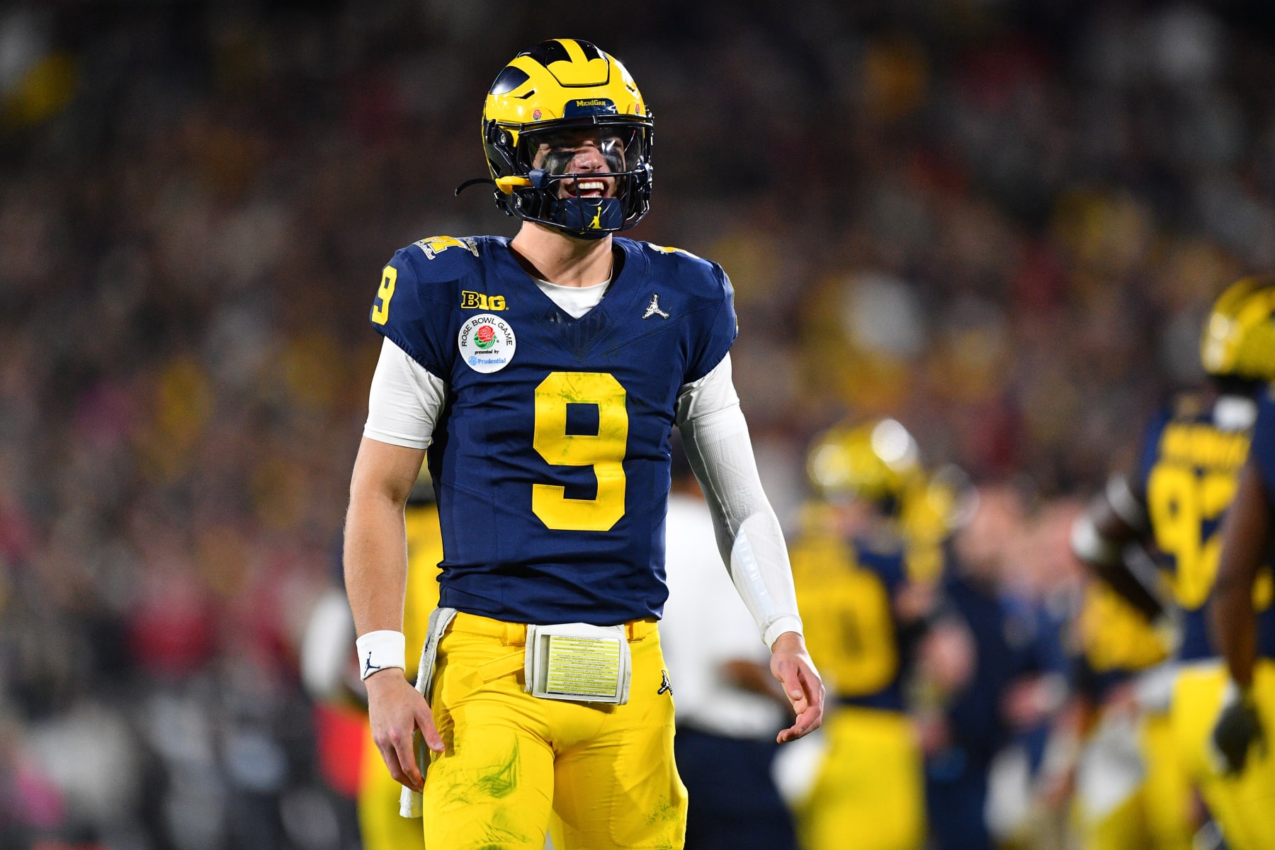 PASADENA, CA - JANUARY 01: QB J.J. McCarthy (9) of the Michigan Wolverines tries to pump up the crowd during the Alabama Crimson Tide game versus the Michigan Wolverines CFP Semifinal at the Rose Bowl Game on January, 1, 2024, at the Rose Bowl Stadium in Pasadena, CA. (Photo by Brian Rothmuller/Icon Sportswire via Getty Images)